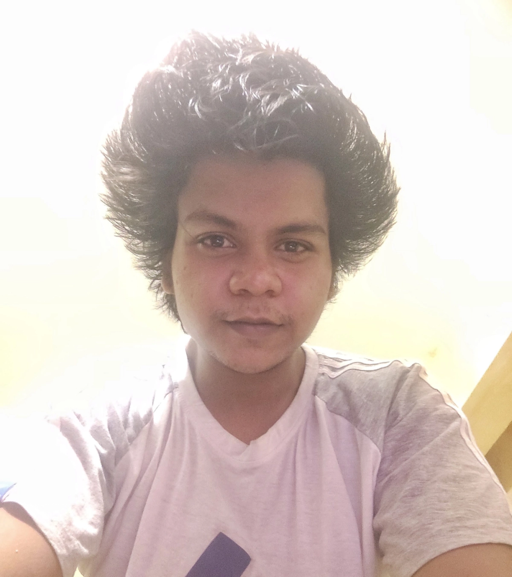 Selfie of frizzy, sun-bleached hair standing straight up after being styled with a heat gun instead of a hair dryer