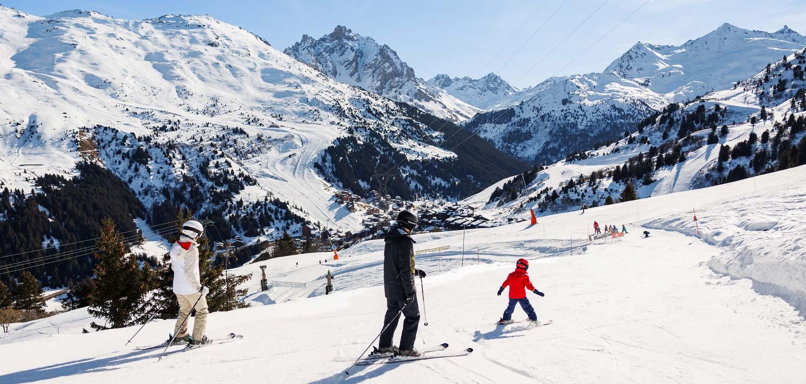 A family skiing in Meribel