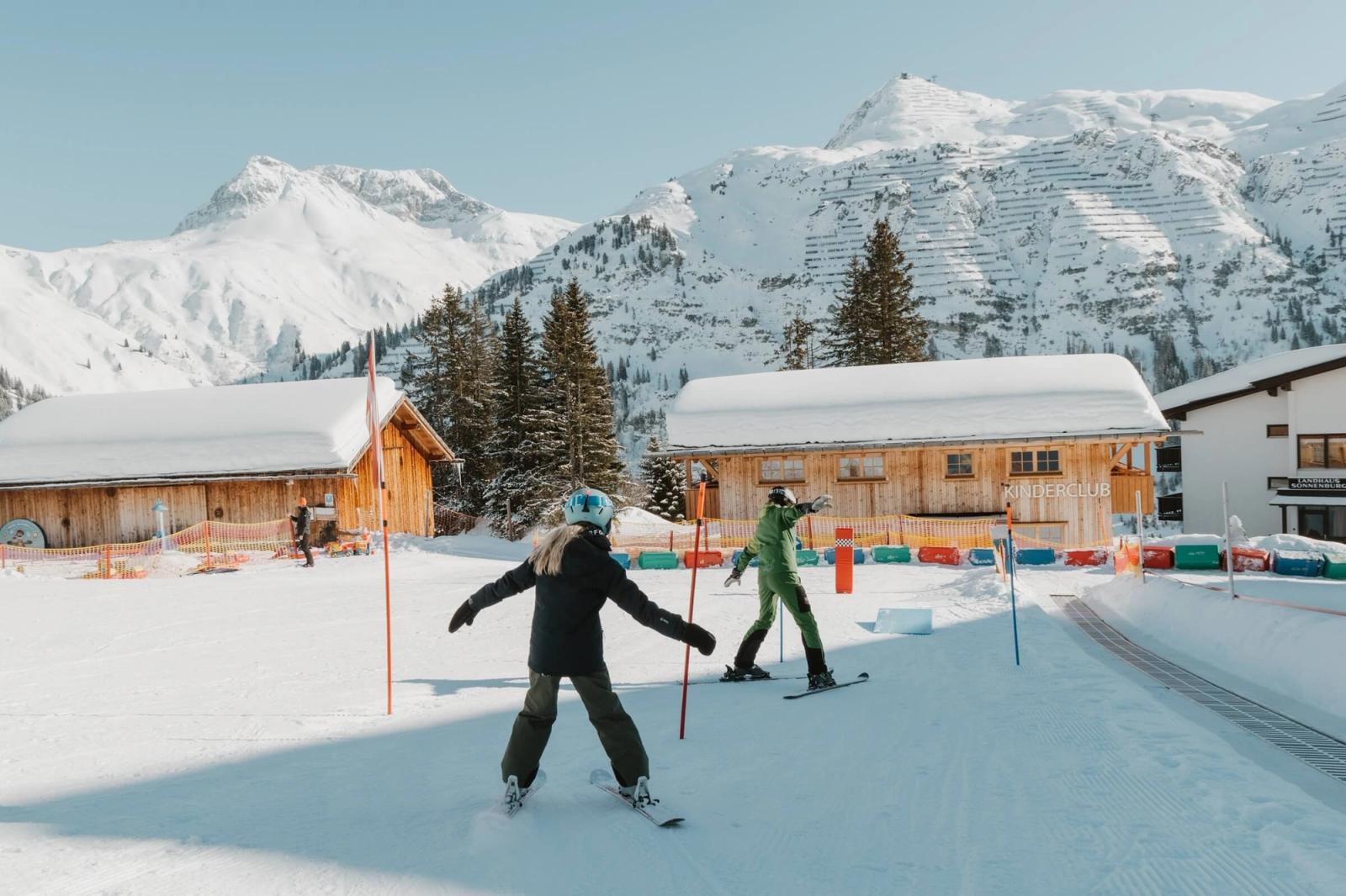 Child skiing during a ski school lesson in Lech