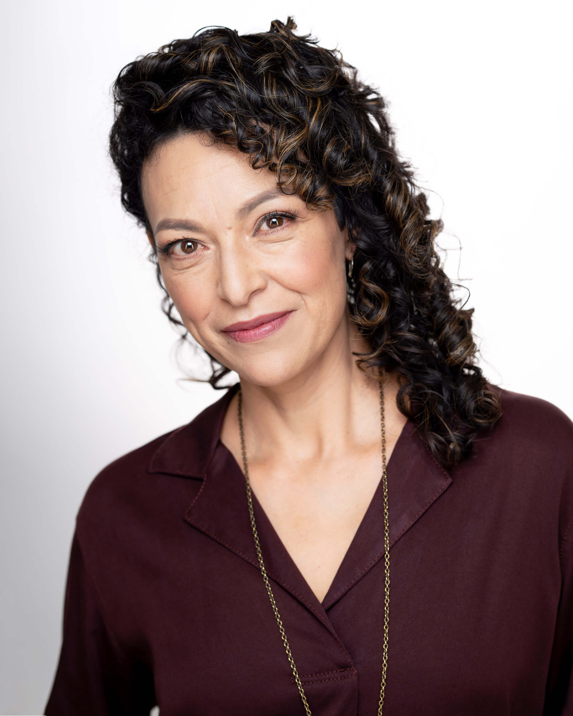 Headshot of Tania Alvarado against a white backdrop