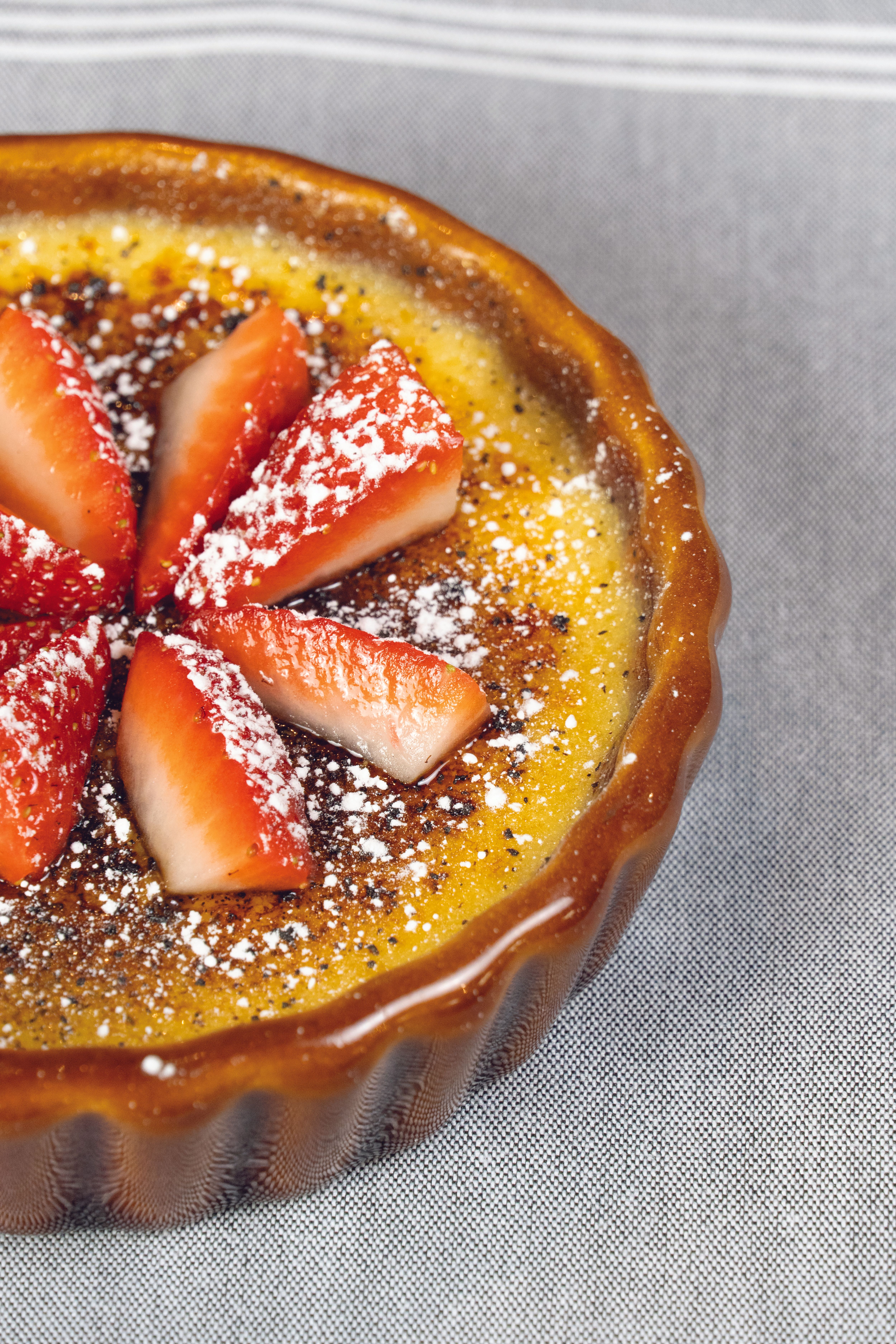 Creme Brulee Topped with Strawberries