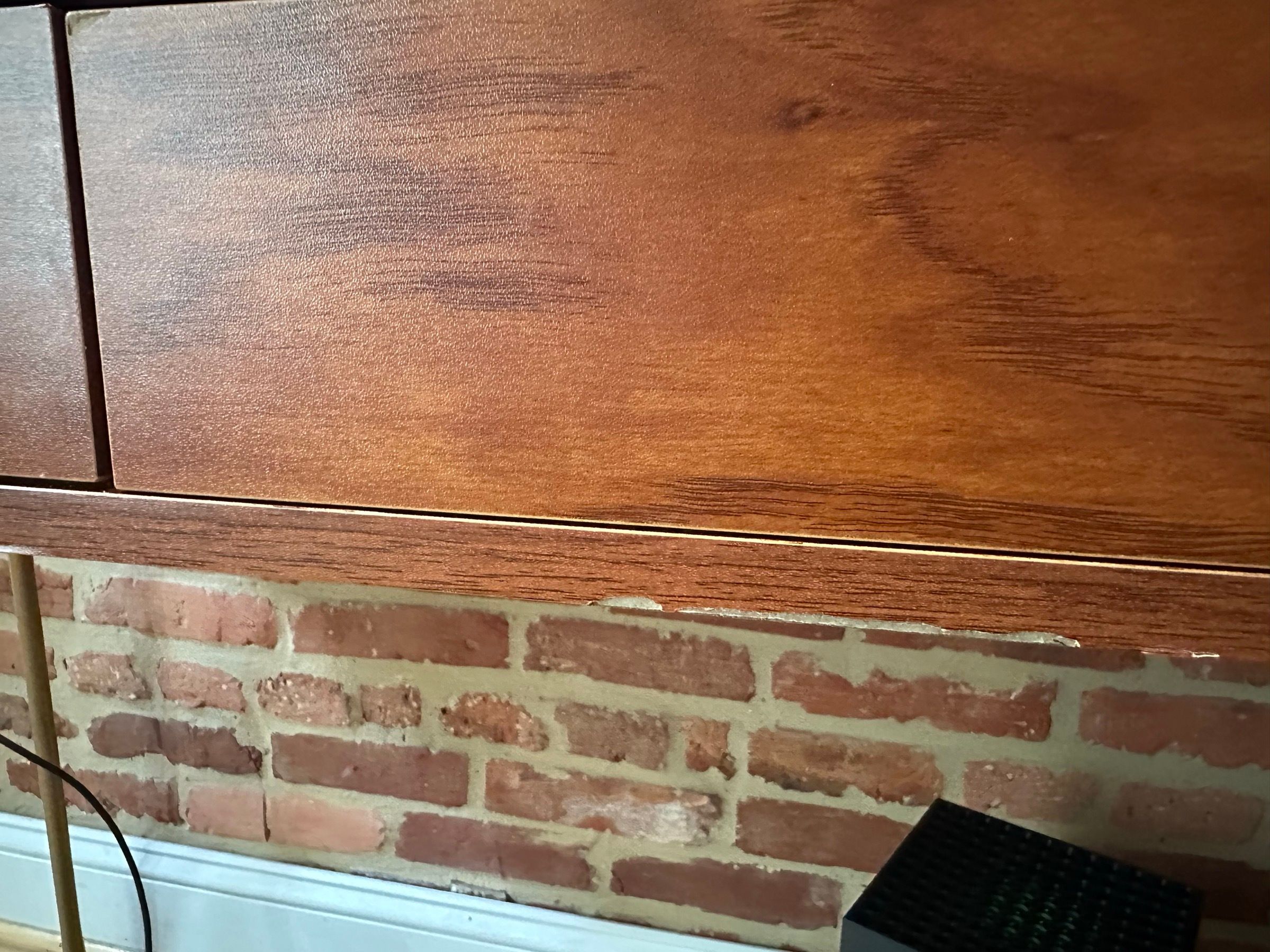 Midcentury-style wood desk with brass hairpin legs and two drawers.