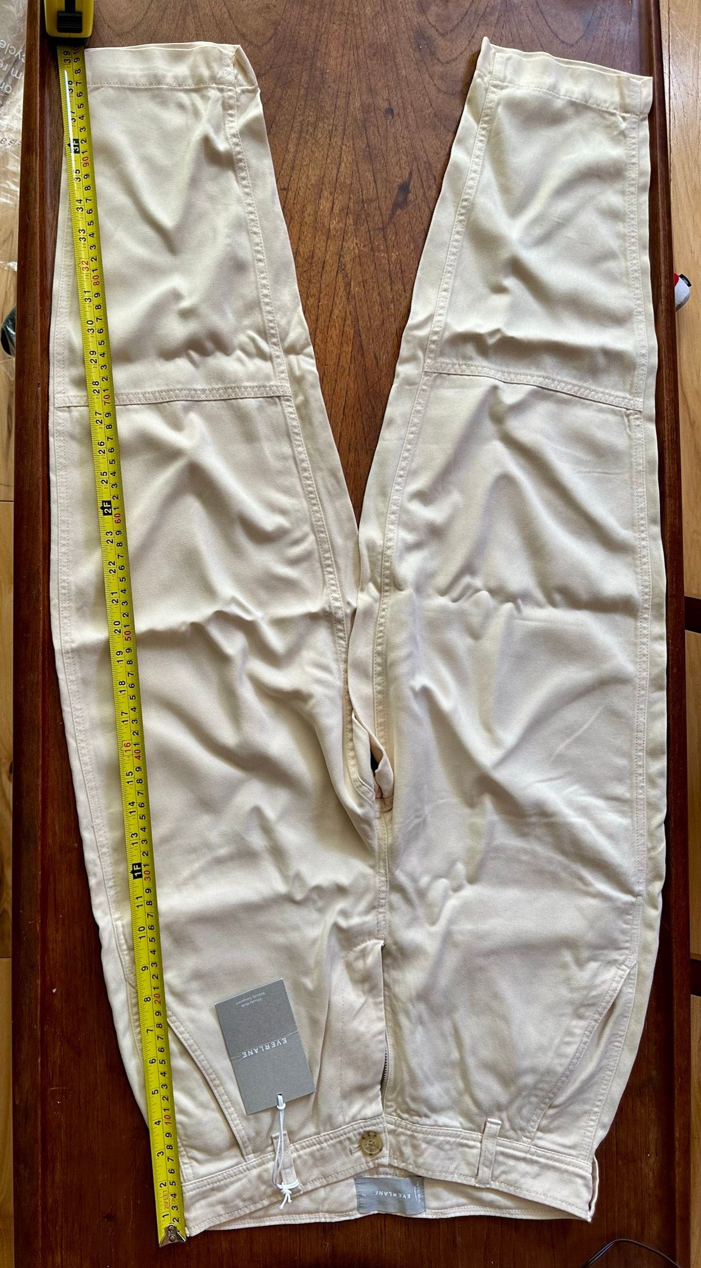 Inseam measurement — tape measure along the inner leg.