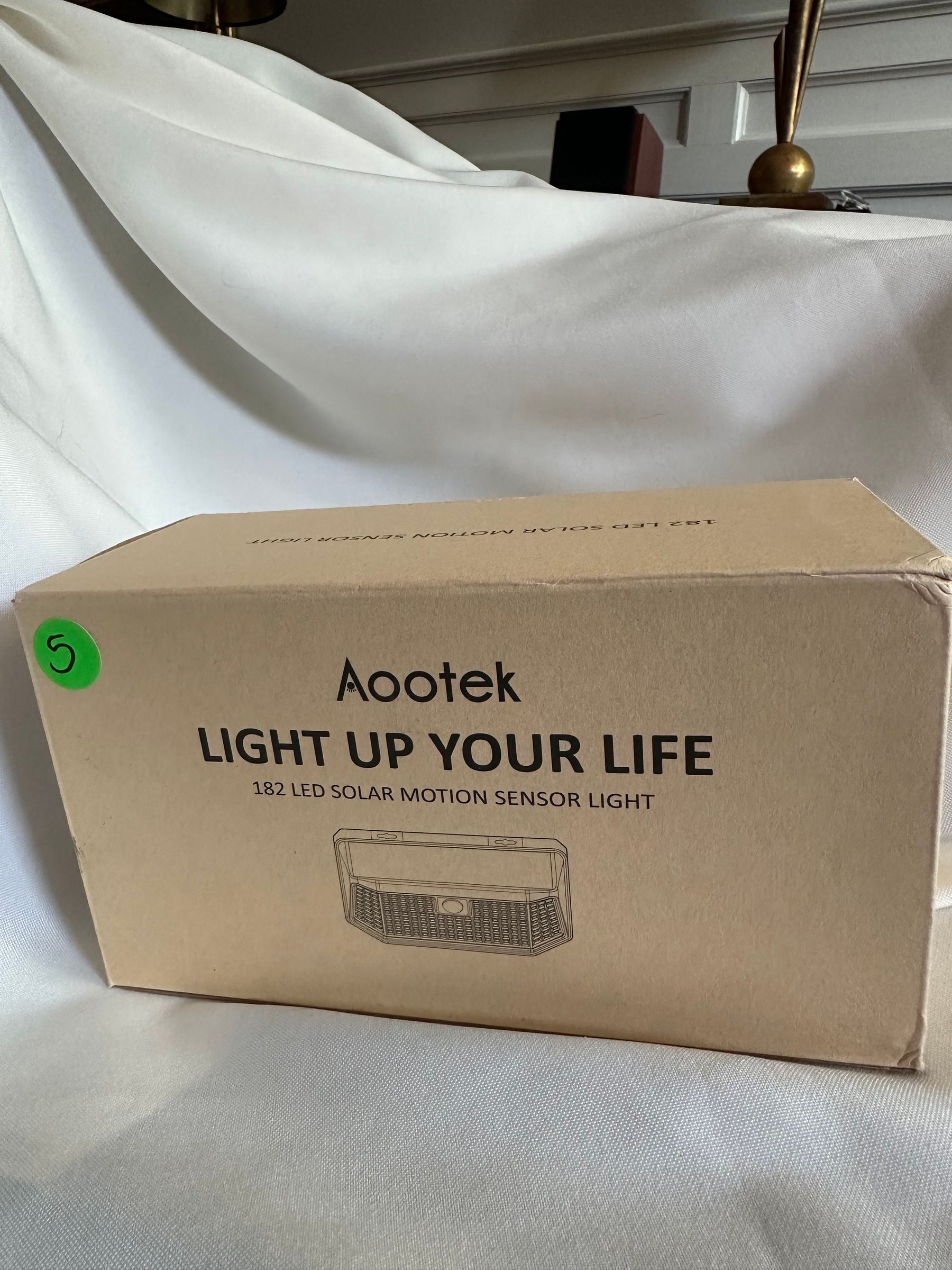 Aootek 182-LED solar motion-sensor security light, new in box.