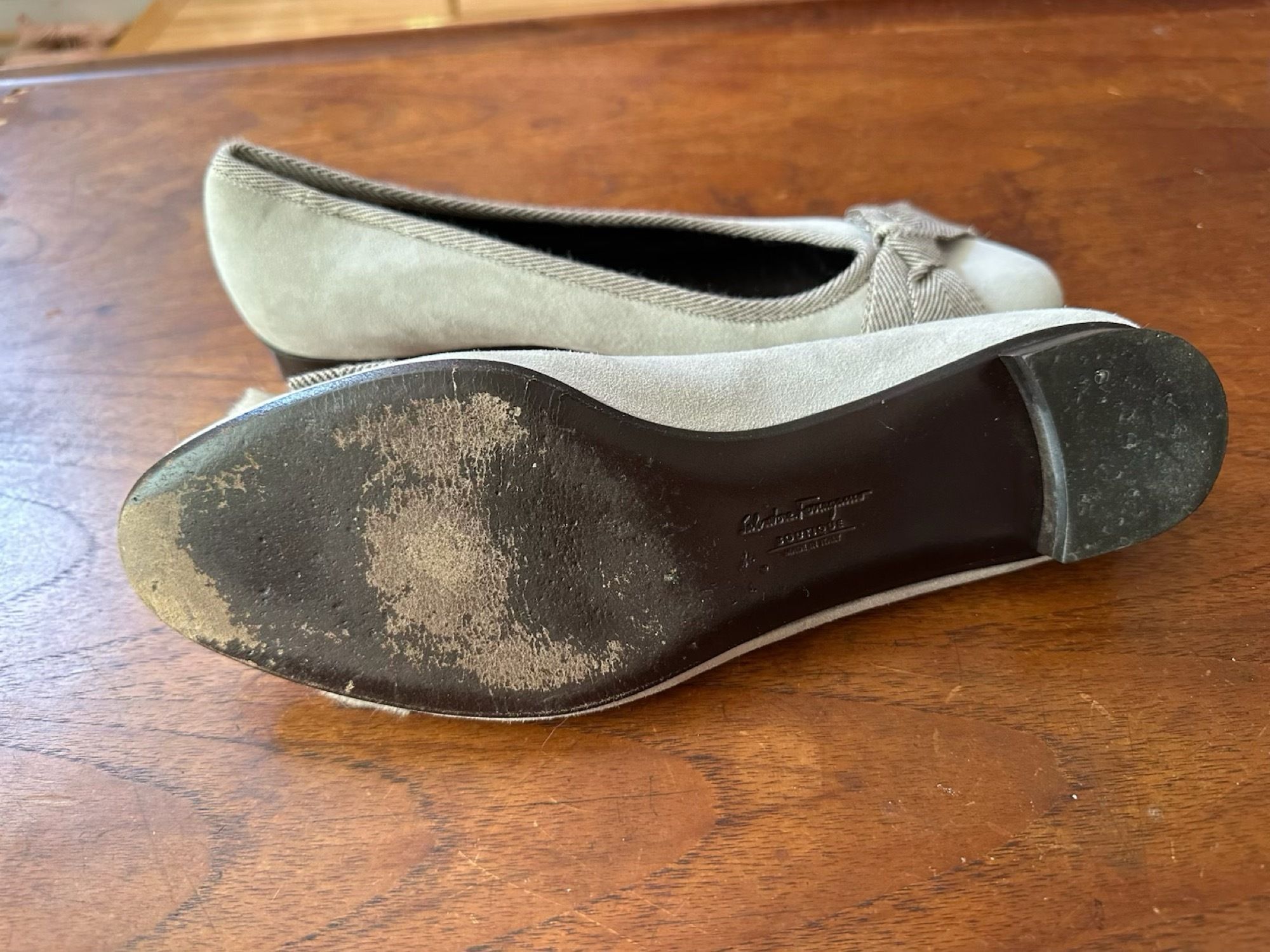 Light grey suede Ferragamo flats with a brown herringbone tweed tassel bow, size 9 1/2 B.