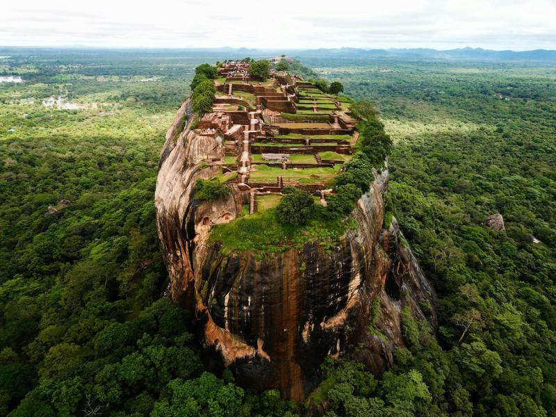 Aerial view of Sigiriya Lion Rock fortress ruins rising above the jungle in Sri Lanka