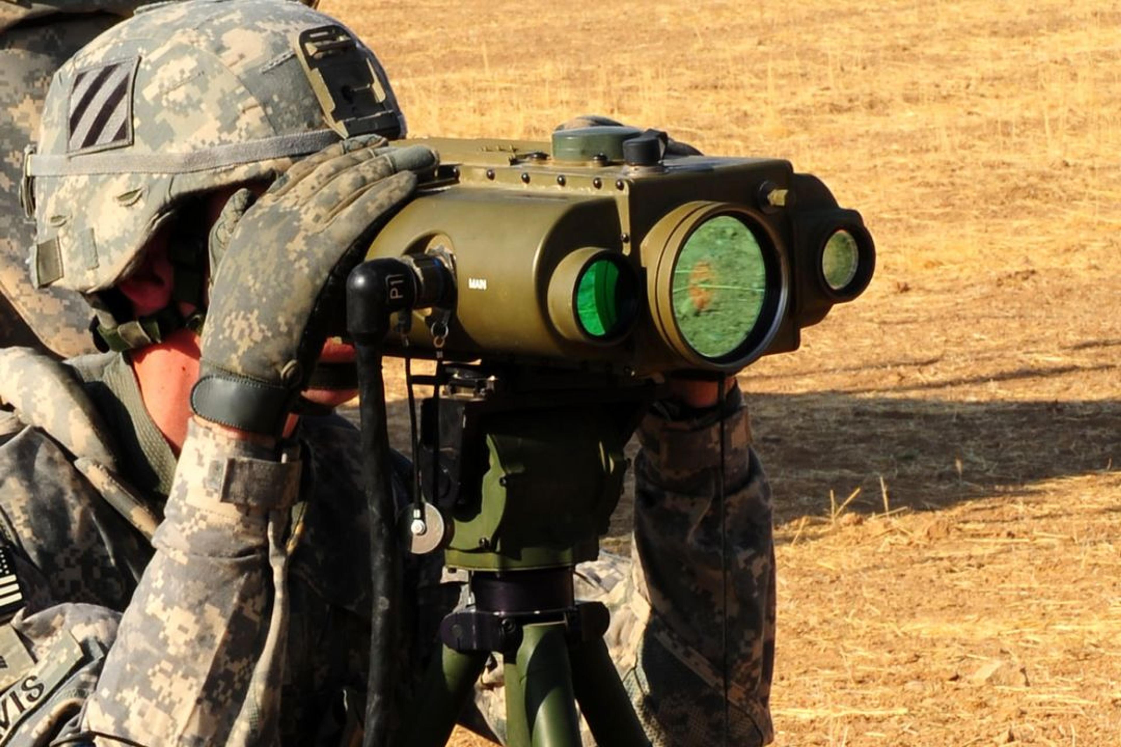 solider looking through sighting device