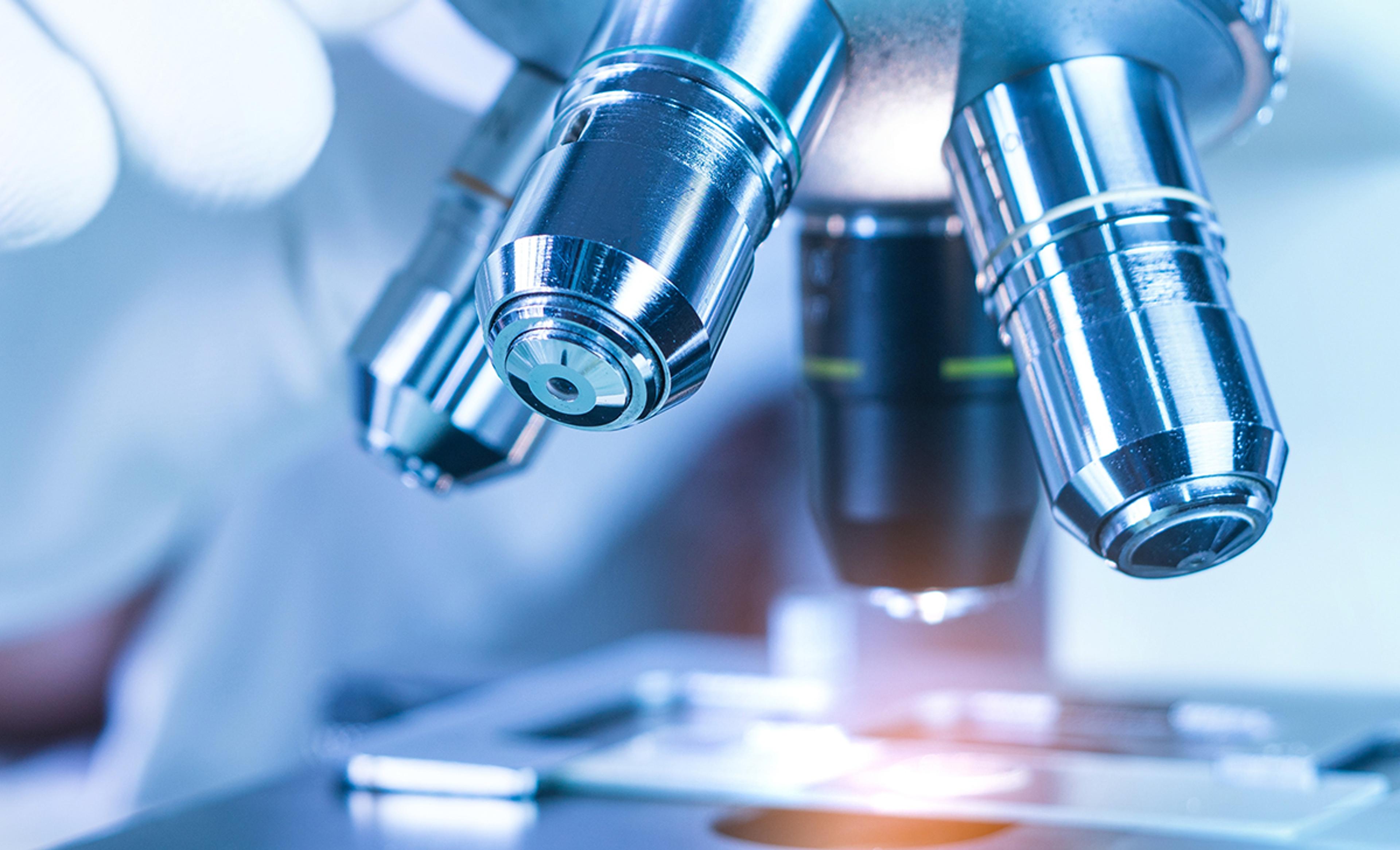 Close-up of microscope objective lenses used in scientific instrumentation and laboratory research