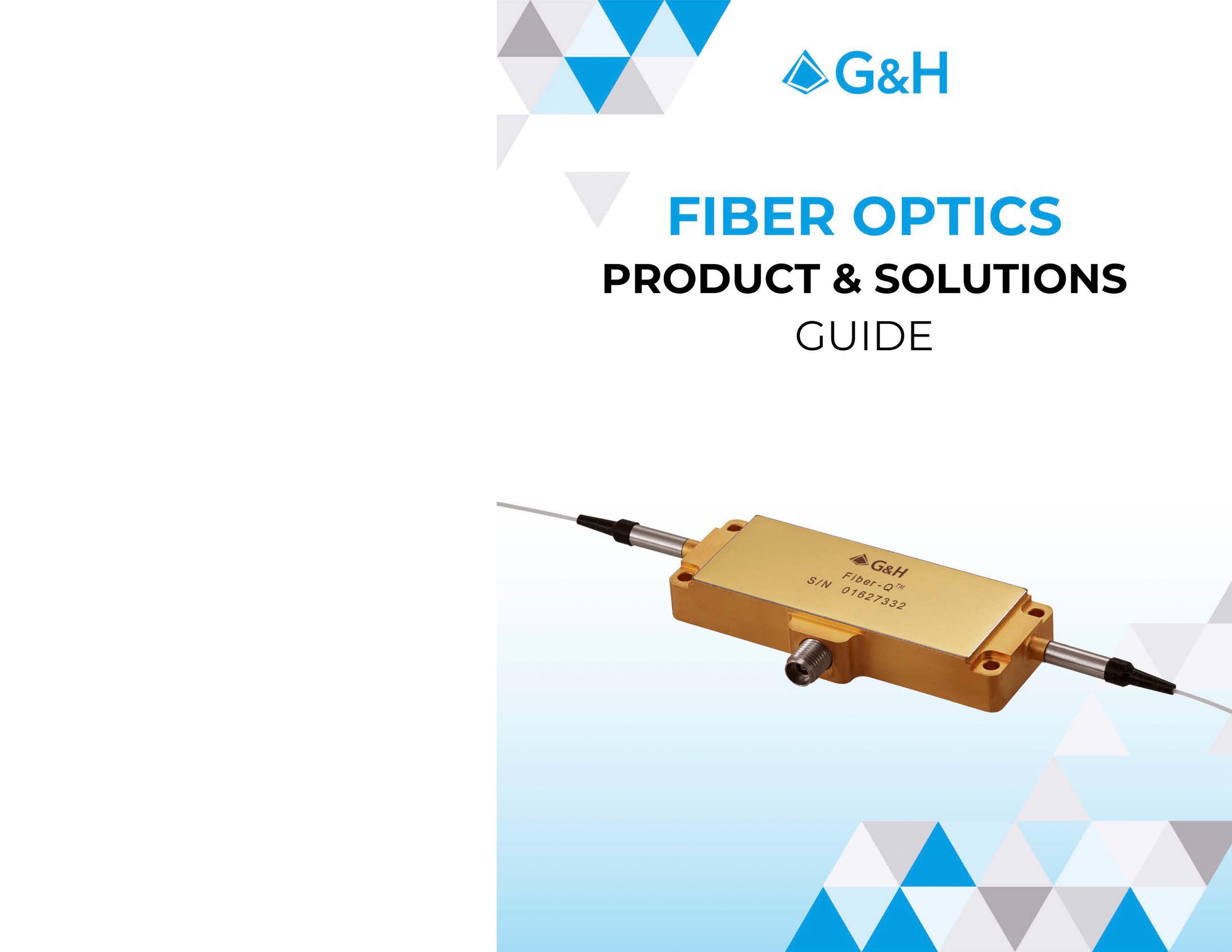 G&H Product & Solutions Guide - Fiber Optics Page 01. Cover of the "G&H Fiber Optics Product & Solutions Guide." A rectangular gold-colored fiber optic component with fiber cables extending from both ends is featured in the center. The device is marked with the G&H logo and serial number. The title text reads: "FIBER OPTICS PRODUCT & SOLUTIONS GUIDE" in bold blue and black font above the image. The background features a gradient from white to light blue with a decorative pattern of blue, gray, and white triangles. The G&H logo is prominently displayed at the top.