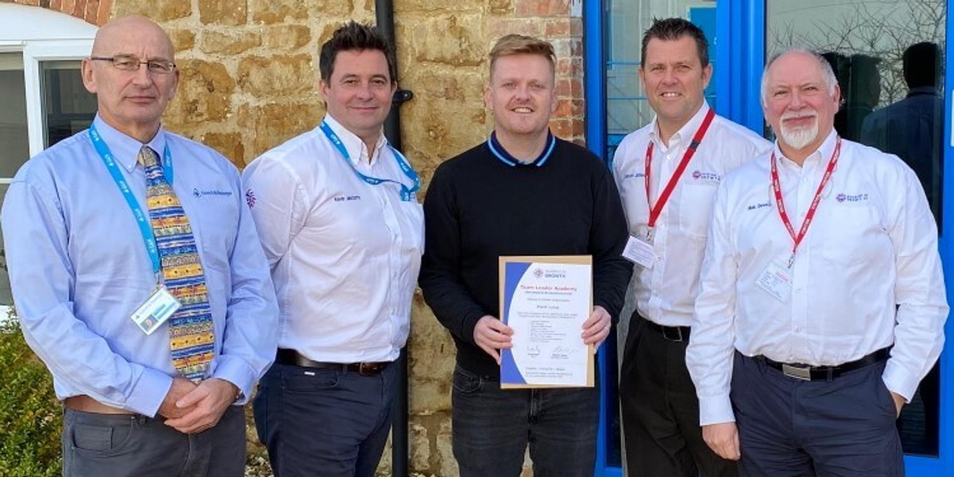 Barry Luke handing over Mark’s certificate witnessed by (L-R) SiG business transformation coach Kev McCarthy, operations executive Malcolm James and board member Nick Devey