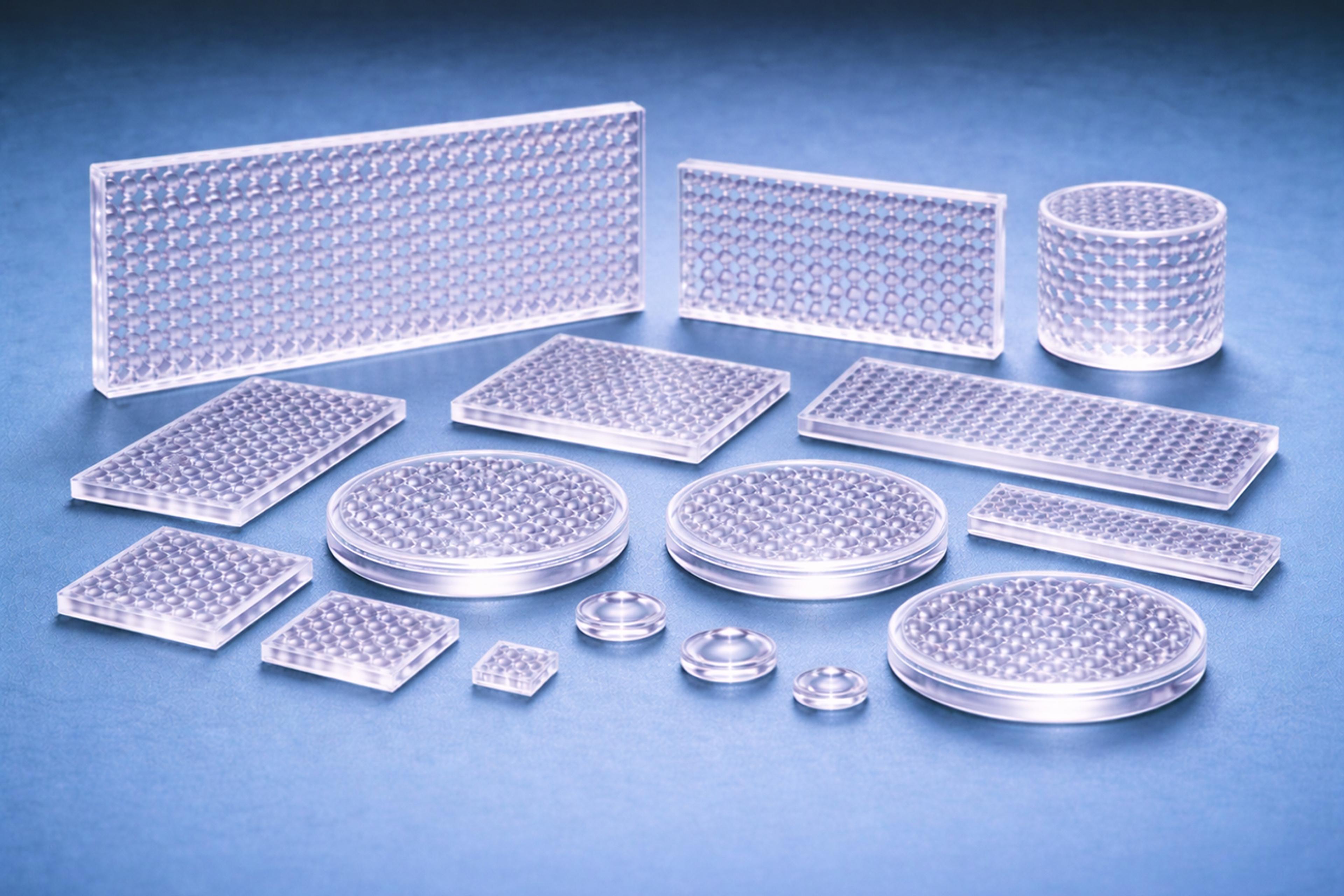 A selection of microlens array polymer optics on a blue graduated background