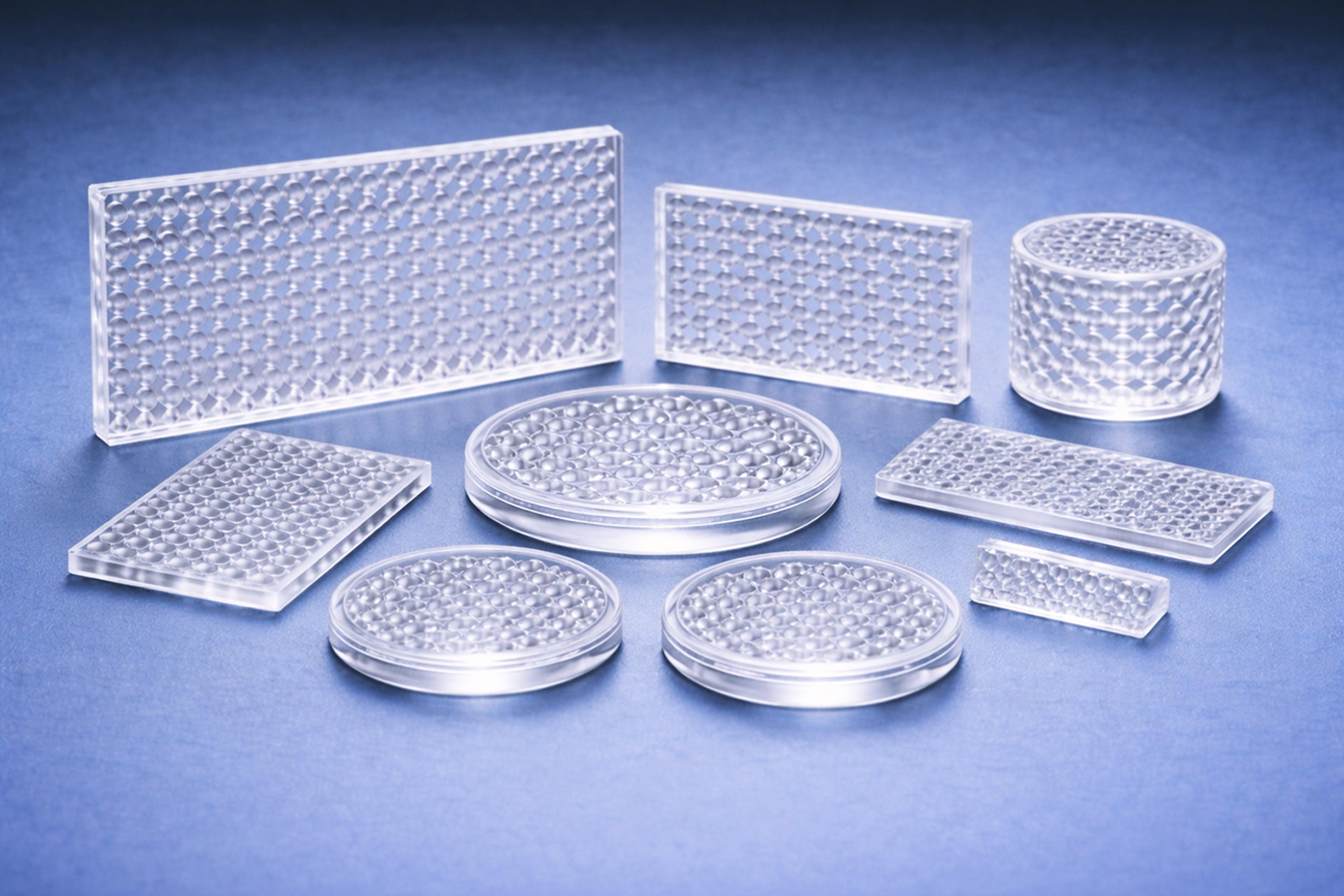 A selection of flys eye polymer optics on a blue graduated background