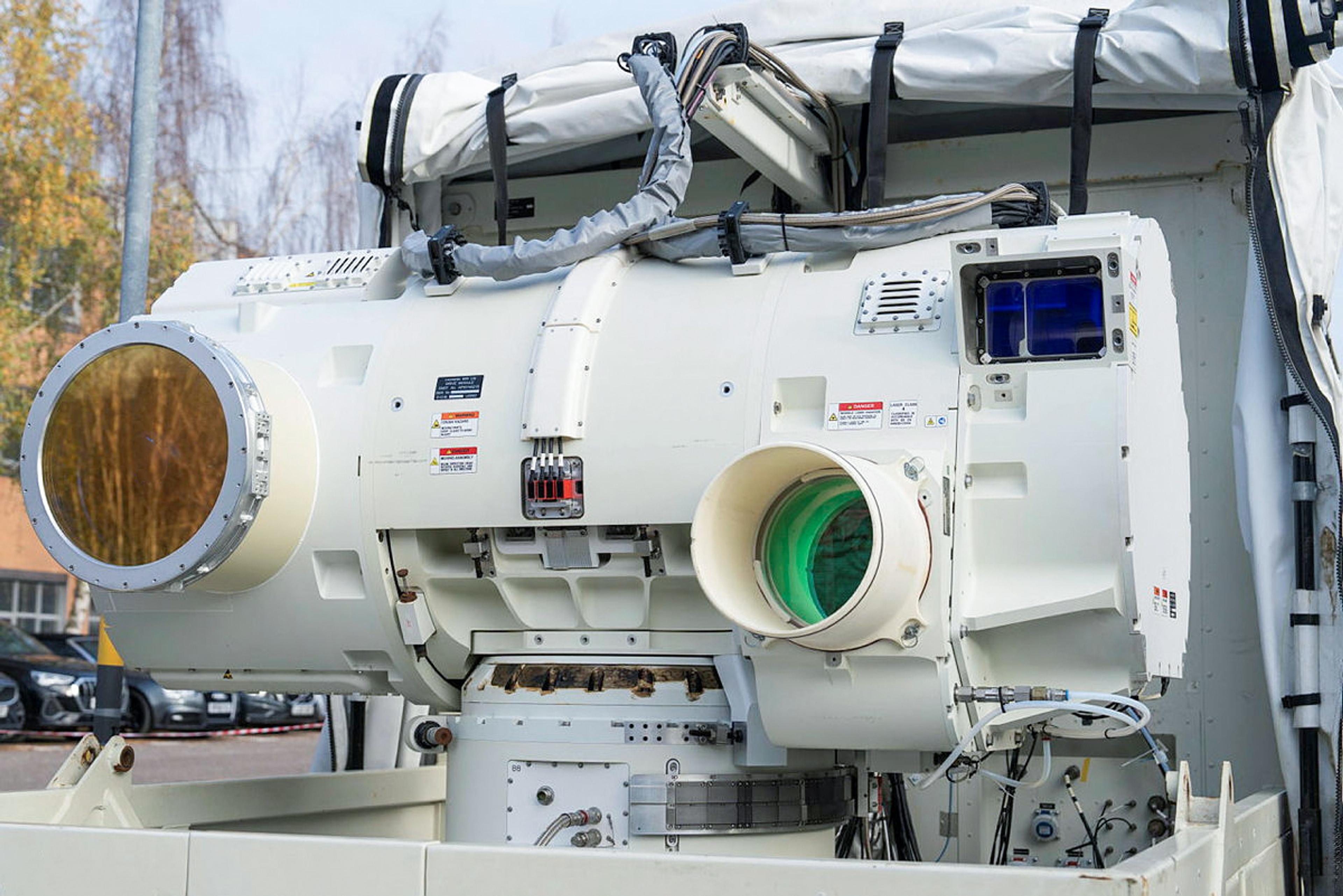Large electro-optical surveillance and targeting system with multiple optical apertures and sensors mounted on a military platform.
