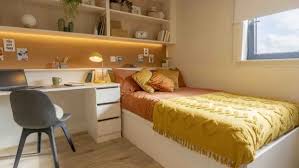 Fully furnished ensuite student room at Haywood Residence featuring a study area and modern interiors in London.