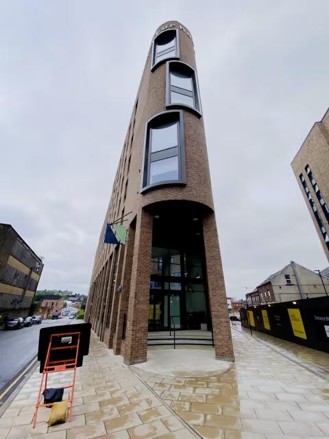 Modern exterior highlighting the property's distinctive architecture and welcoming entrance.