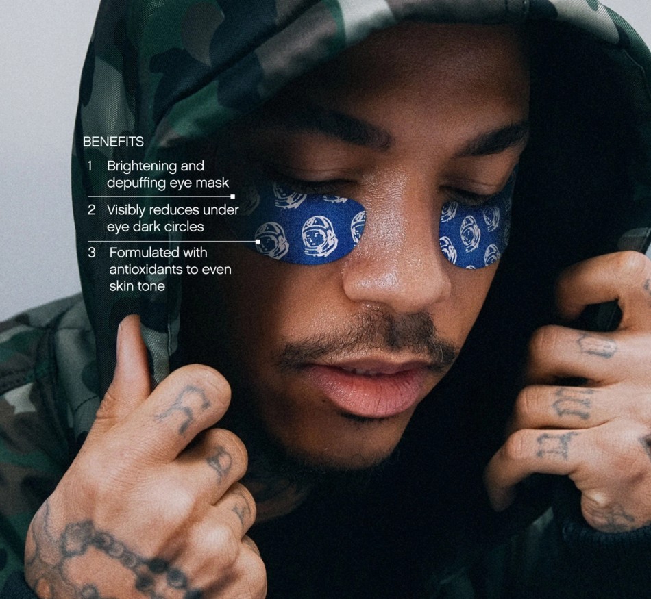 Man in a camouflage hoodie wearing blue eye masks with astronaut helmet patterns; text lists benefits.