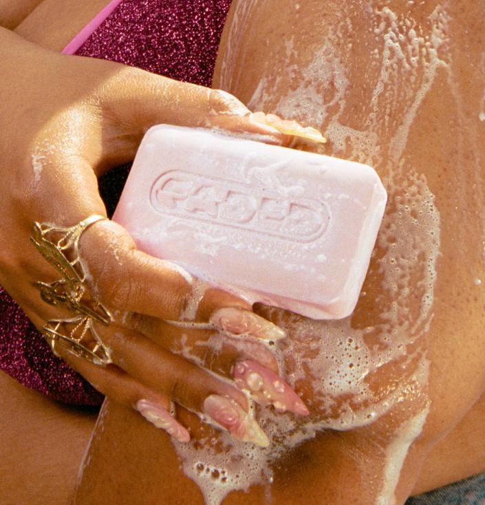 Woman using Cleansing Bar on arm