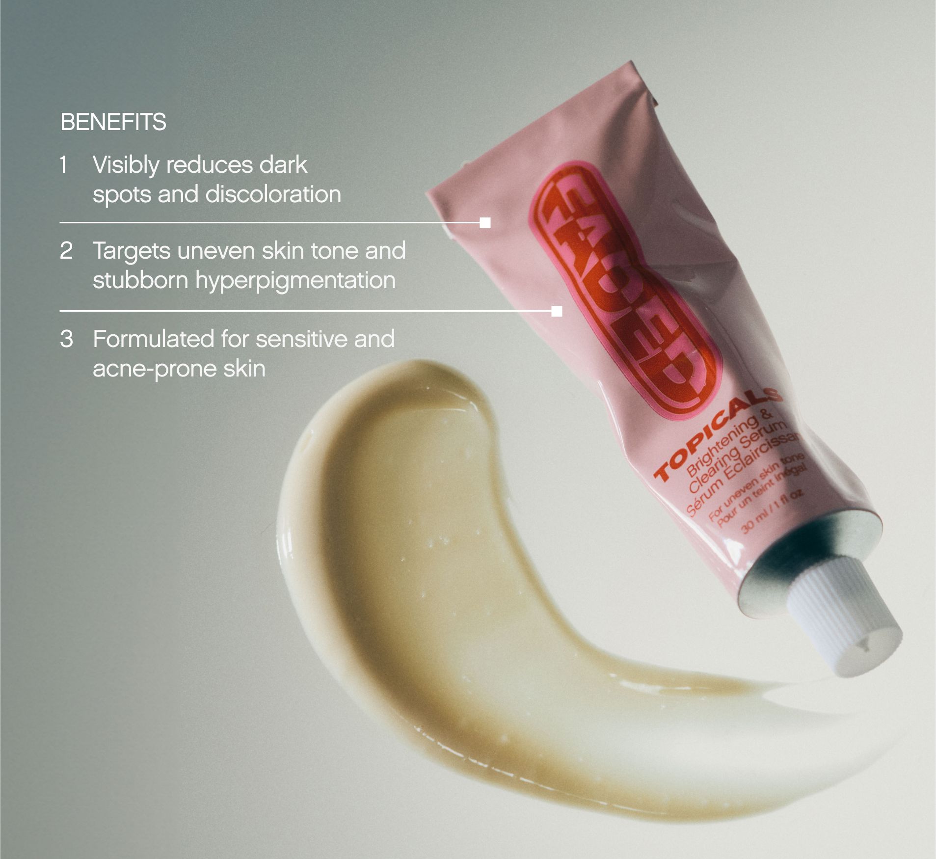 a tube of topical cream is sitting next to a swirl of cream .