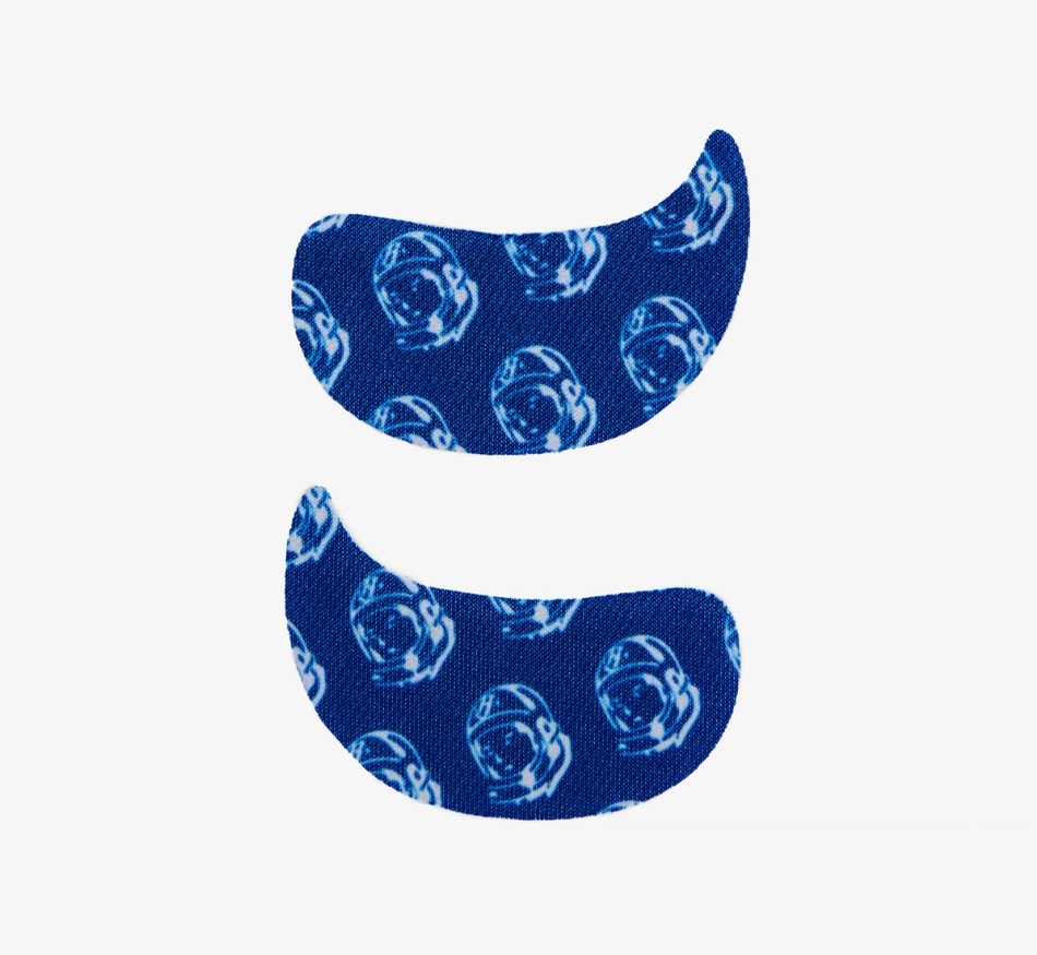 Two blue under-eye patches with a white astronaut helmet pattern.