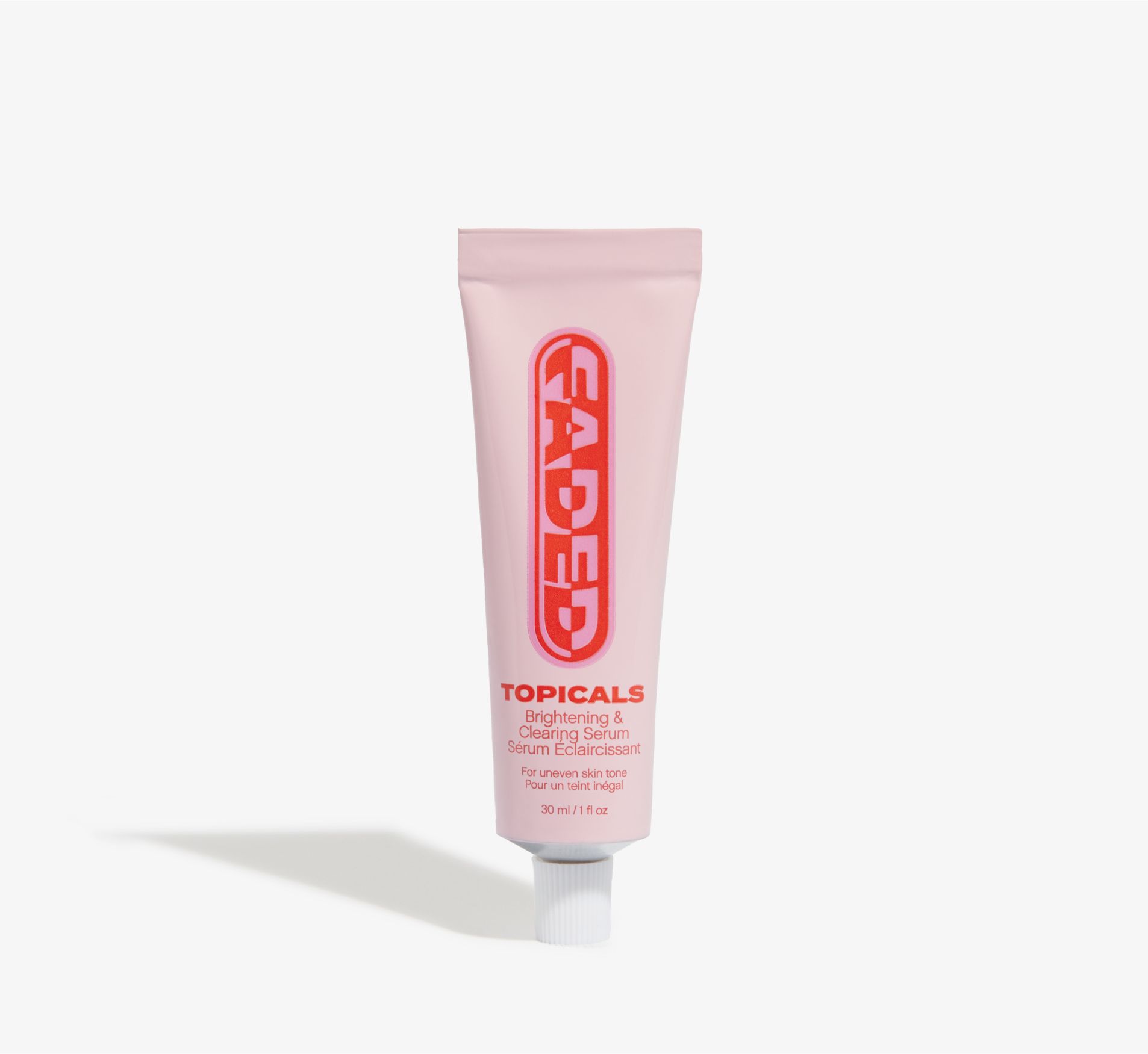 a tube of faded topicals is sitting on a white surface .