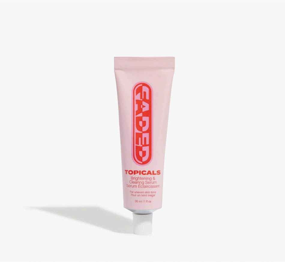 a tube of faded topicals is sitting on a white surface .