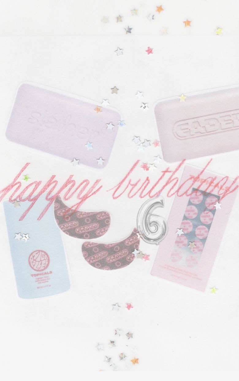 A flat lay of skincare items (soaps, patches), "happy birthday" text, a silver number 6 balloon, and star confetti on a white background.