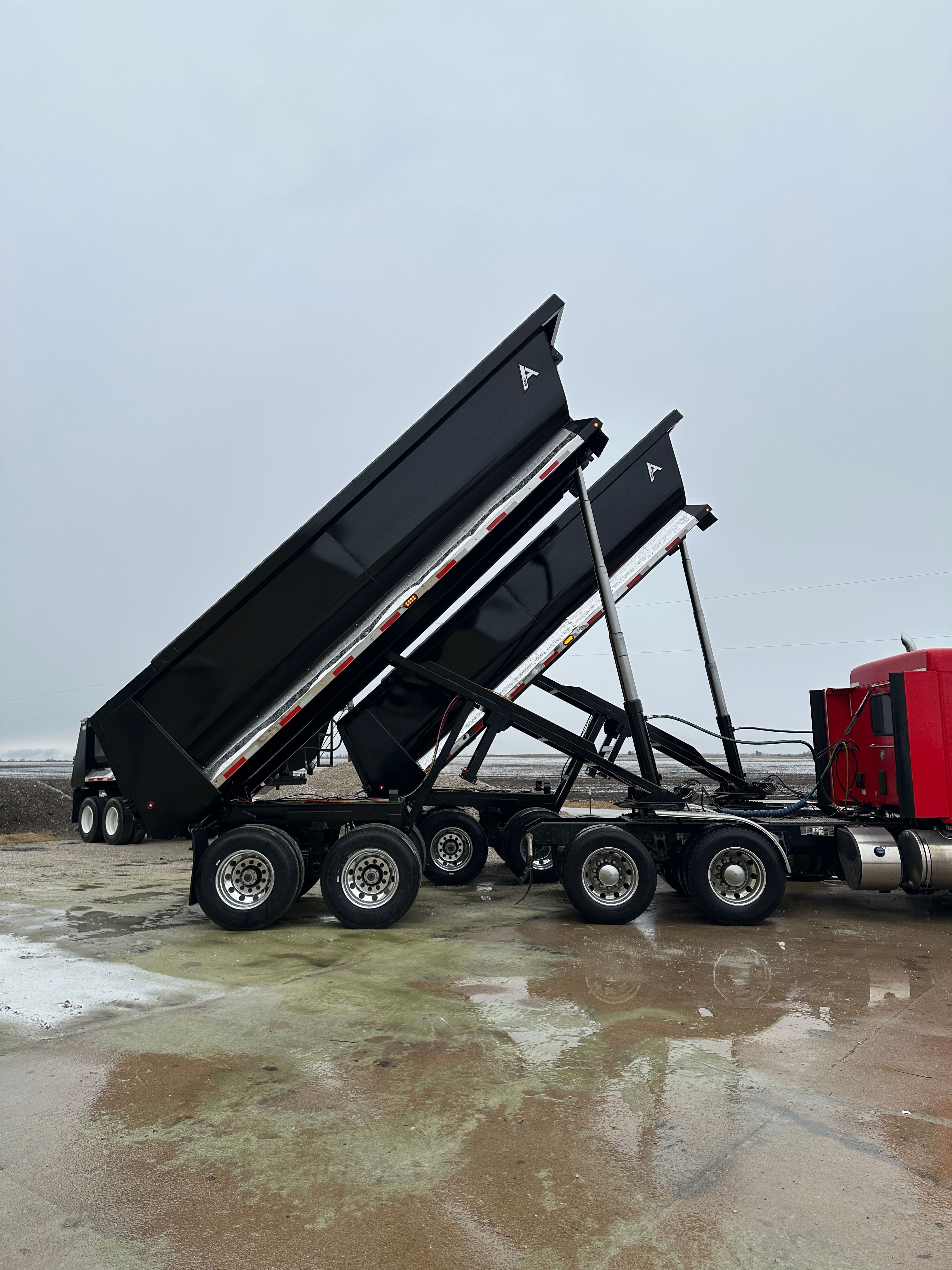 two dump trailers upened up