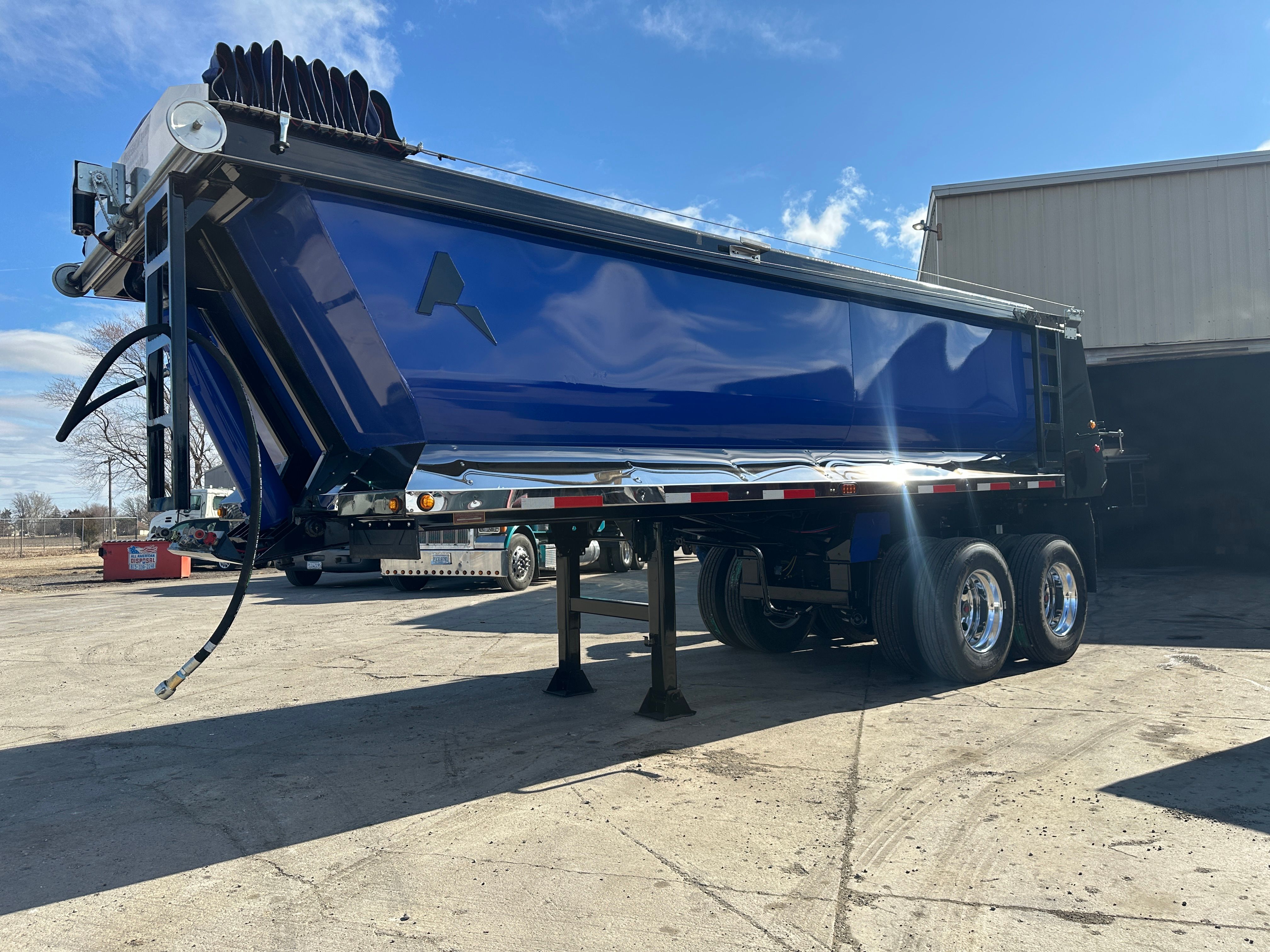 Dump trailer hauling rip rap on a Cedar Rapids levee construction site