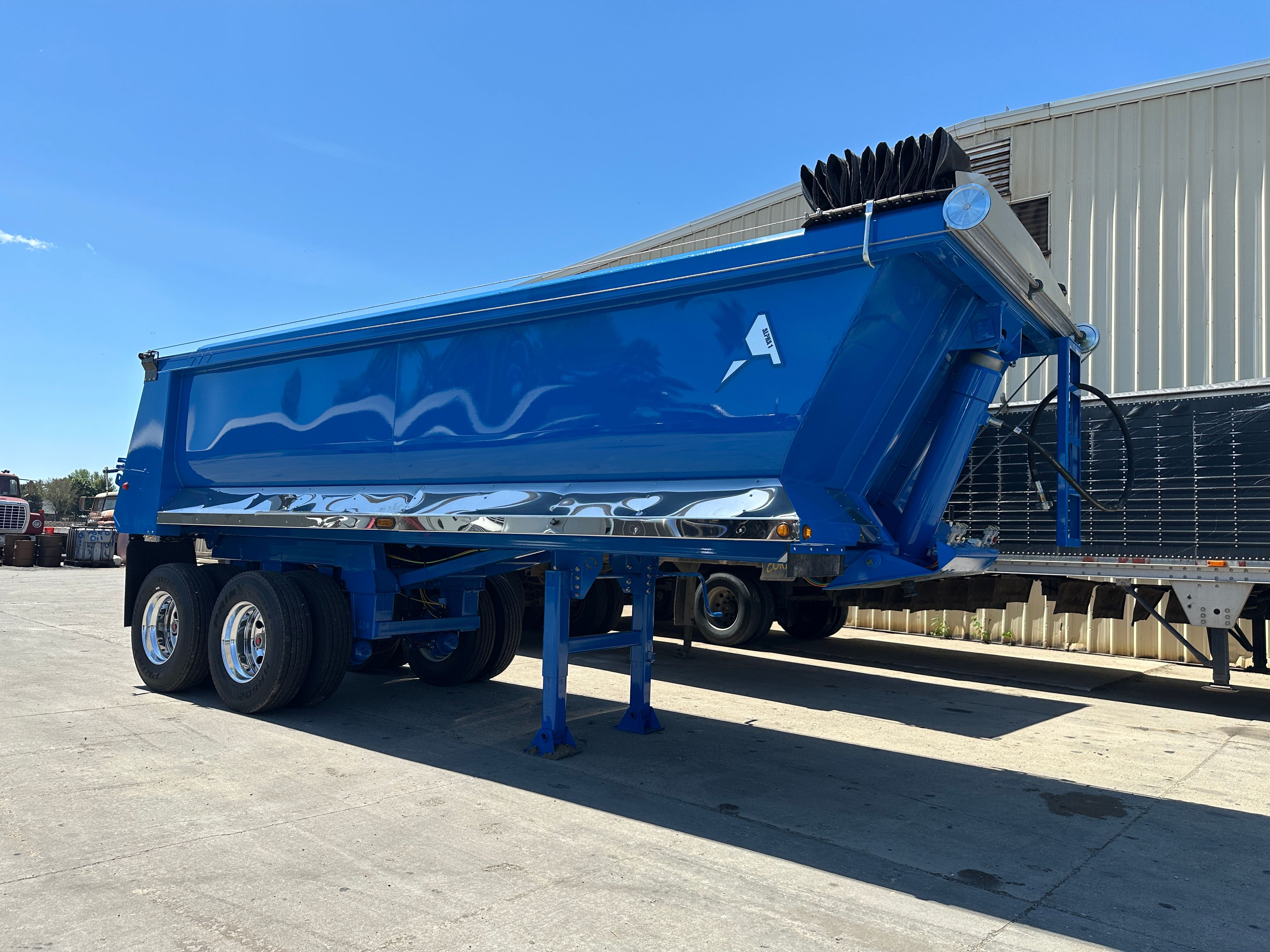 Dump trailer hauling rip rap on a Cedar Rapids levee construction site