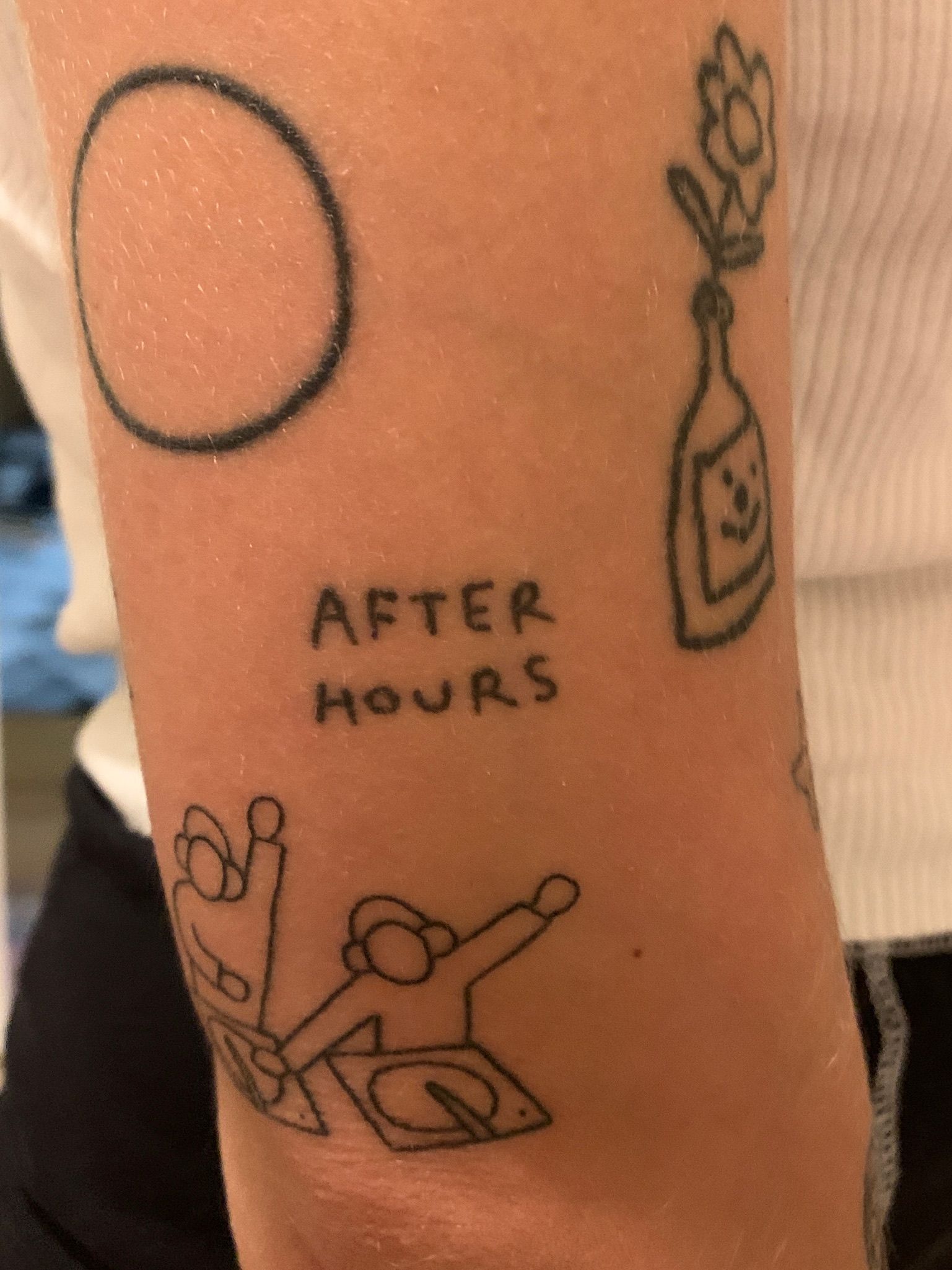 After Hours' business name tattooed on skin