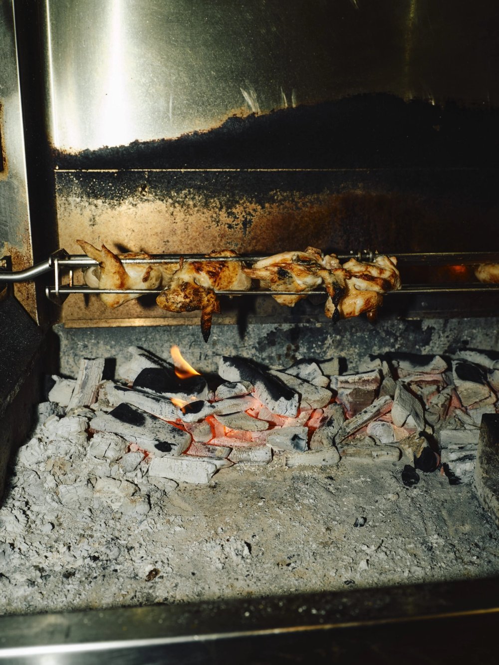Chickens on the spit over the coals
