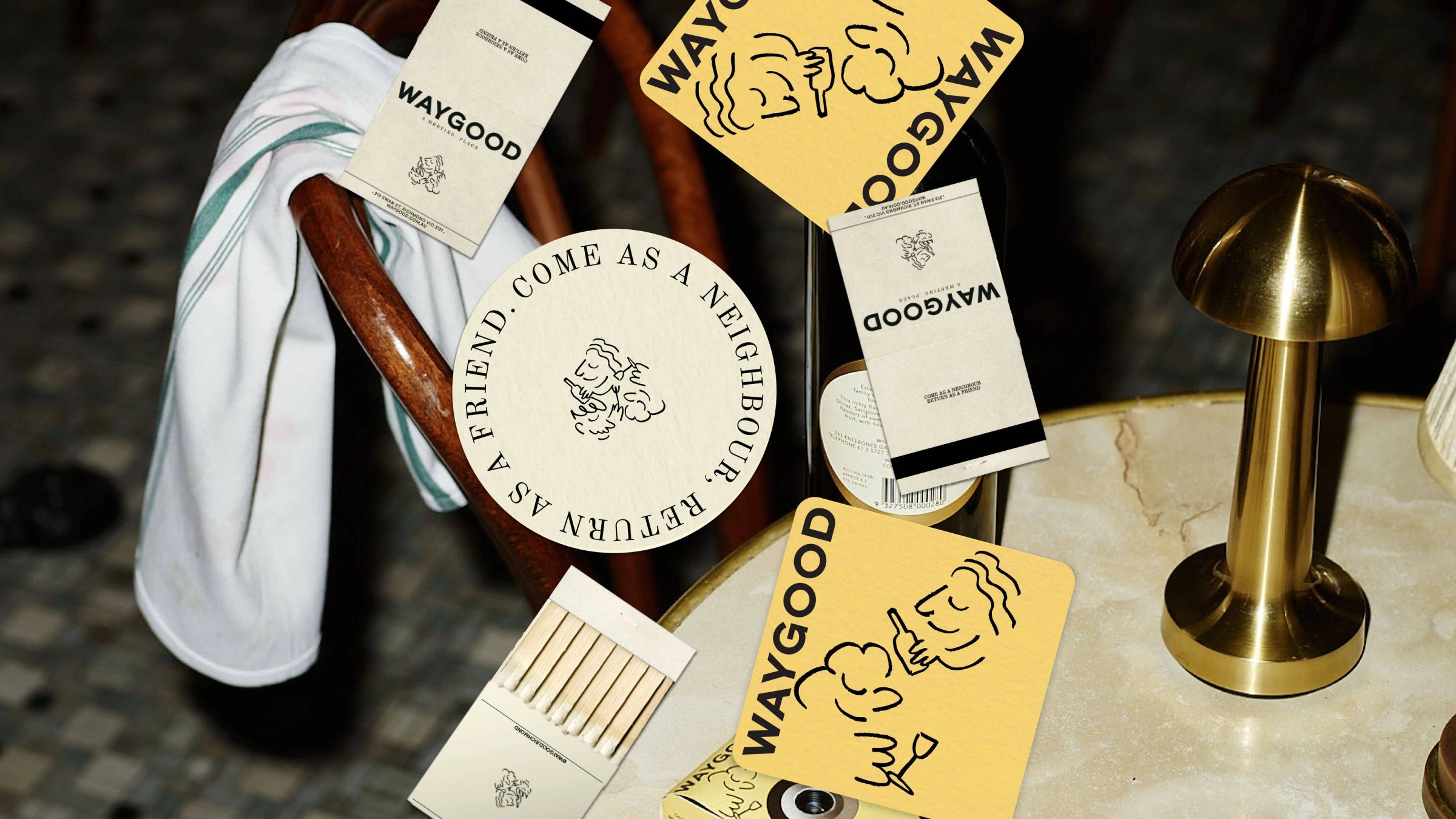 Waygood coasters, matchbooks and cards scattered over a bistro table