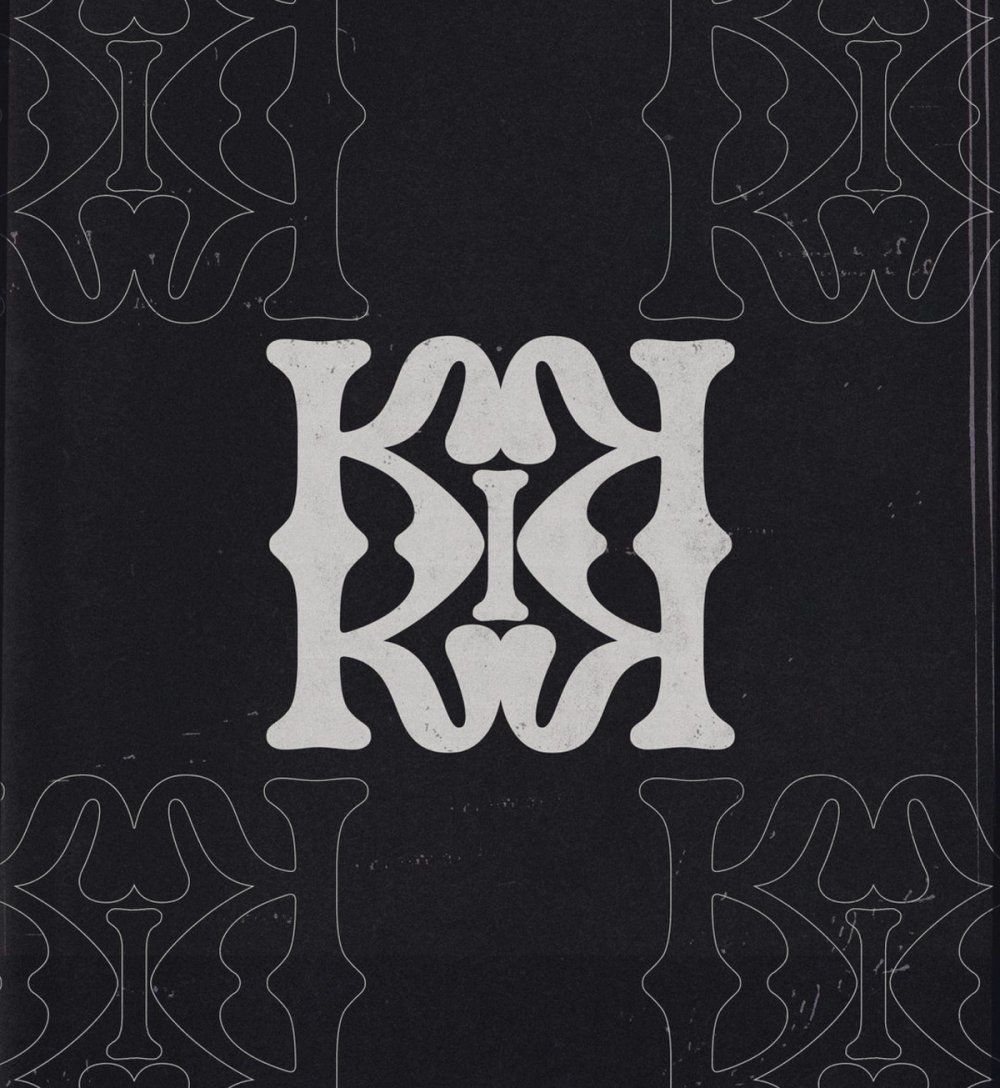 Mirrored KIMIA monogram in cream on black