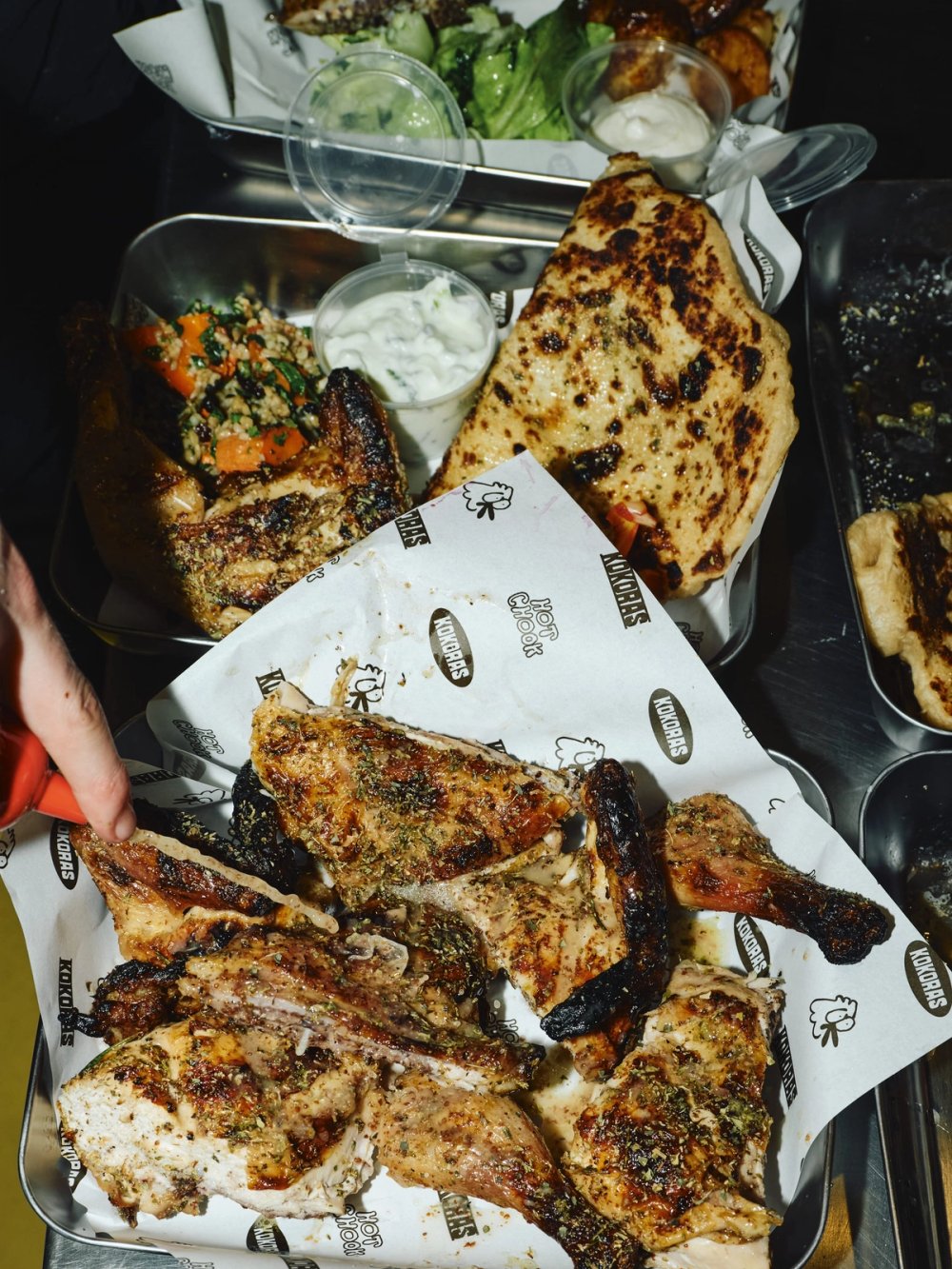 A Kokoras spread of chicken, flatbread and salad