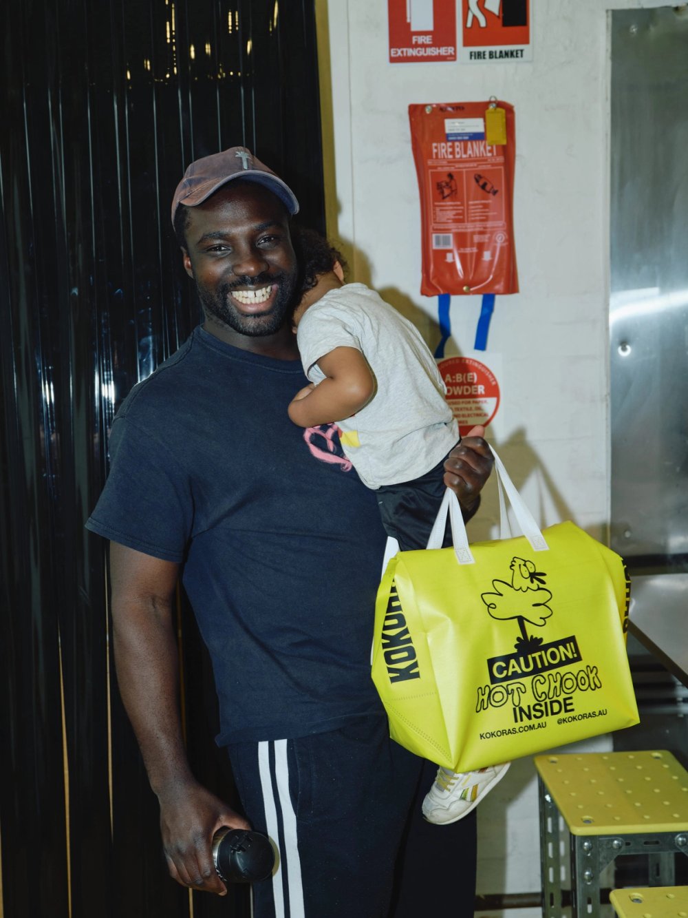 A customer and child leaving with a Kokoras bag