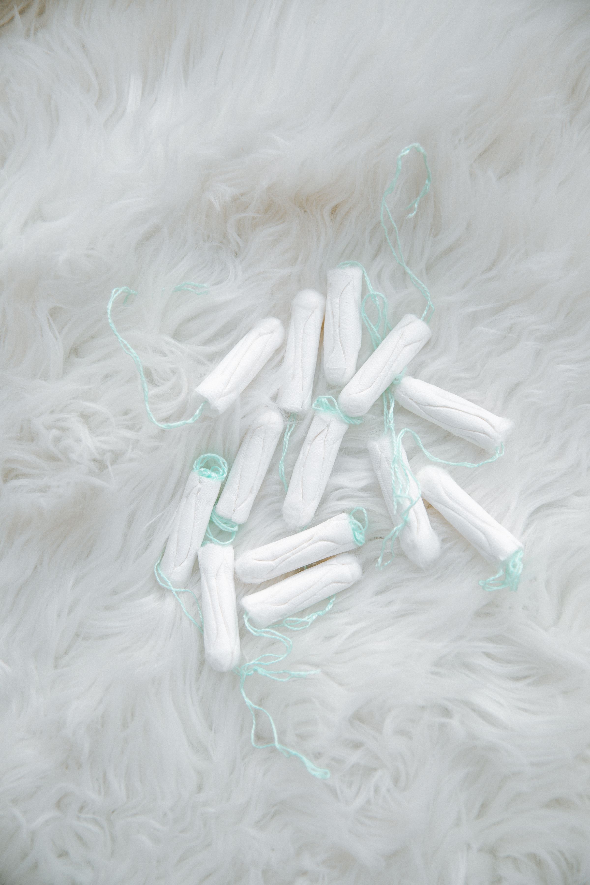 Tampons arranged on a pale surface.