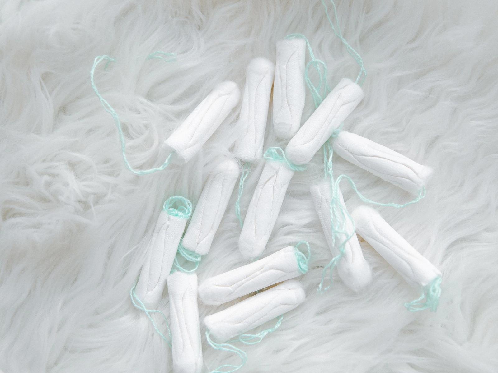 Tampons arranged on a pale surface.