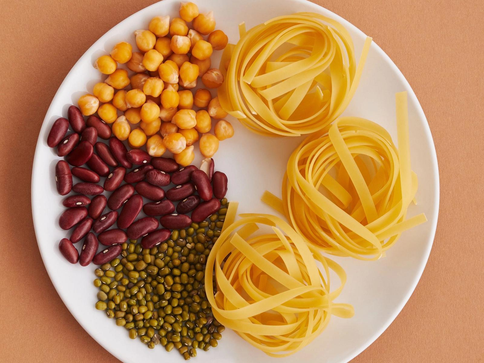 Pasta and pulses arranged on a plate.