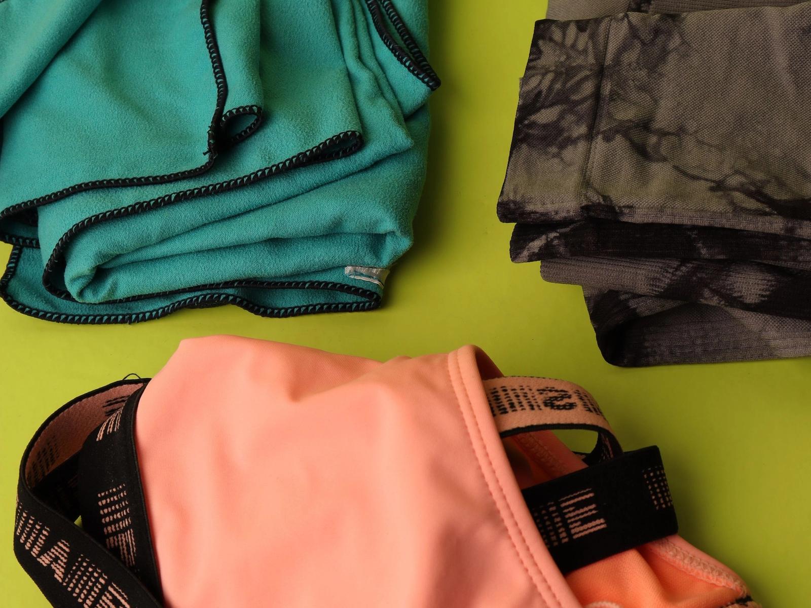 Colorful underwear arranged on green fabric.