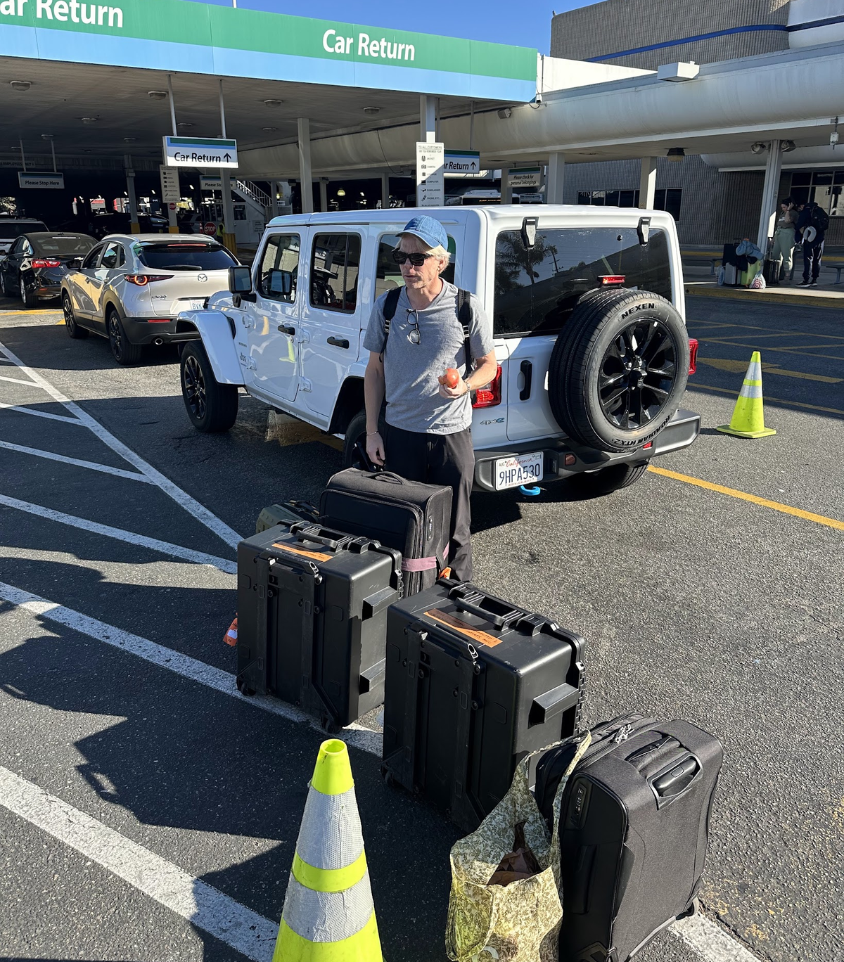 Calle standing infront of luggage in U.S.