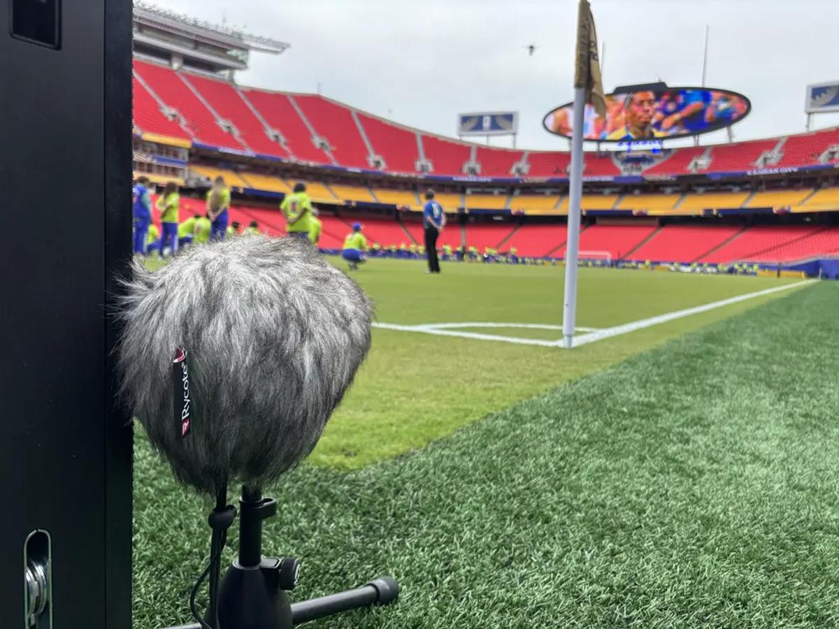 A field-level microphone sits on the perimeter behind the end line at Kansas City Stadium, also known as GEHA Field at Arrowhead Stadium. Image credit: Eric Zornes]