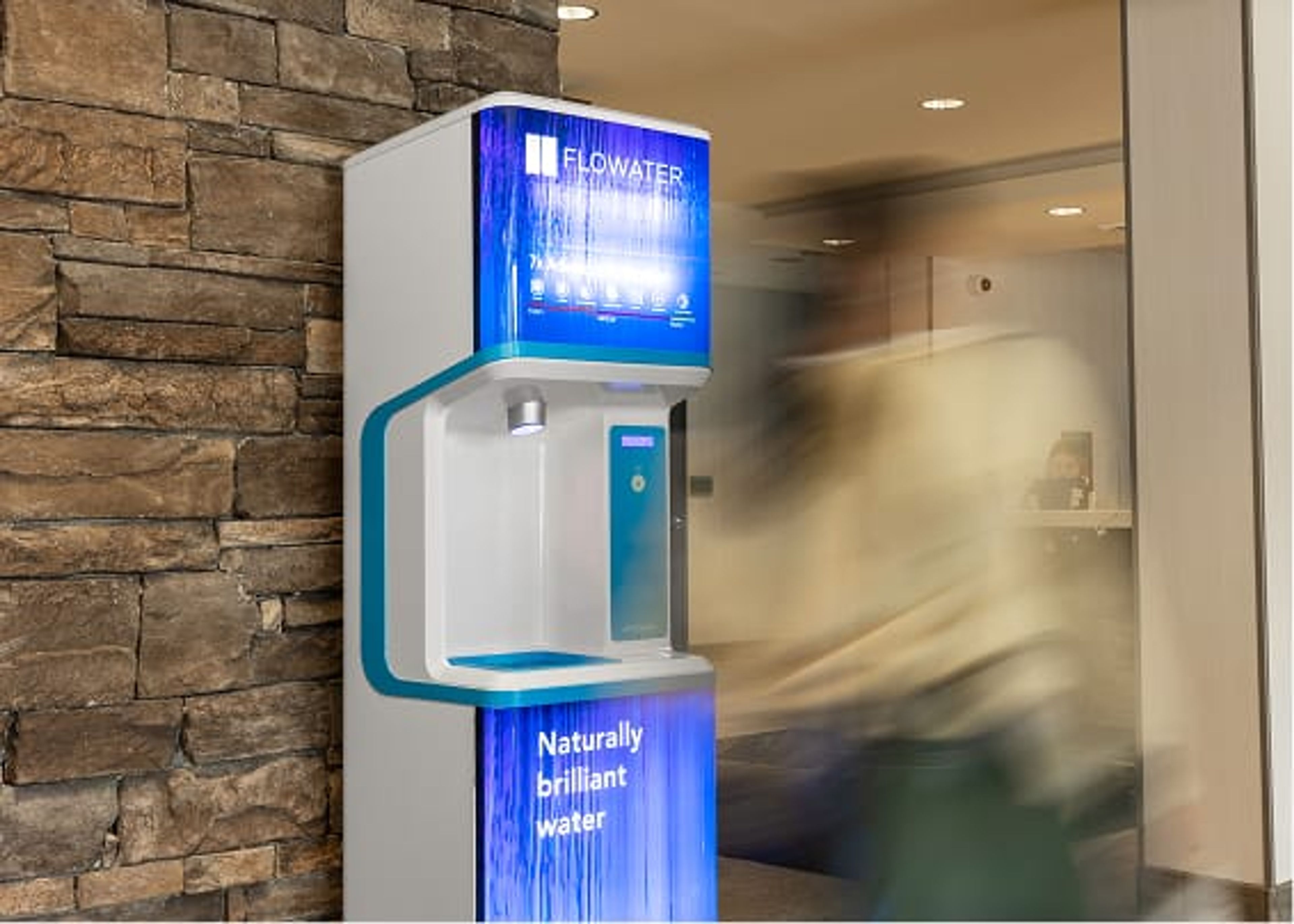 FloWater water dispnser dispensing in a hotel lobby