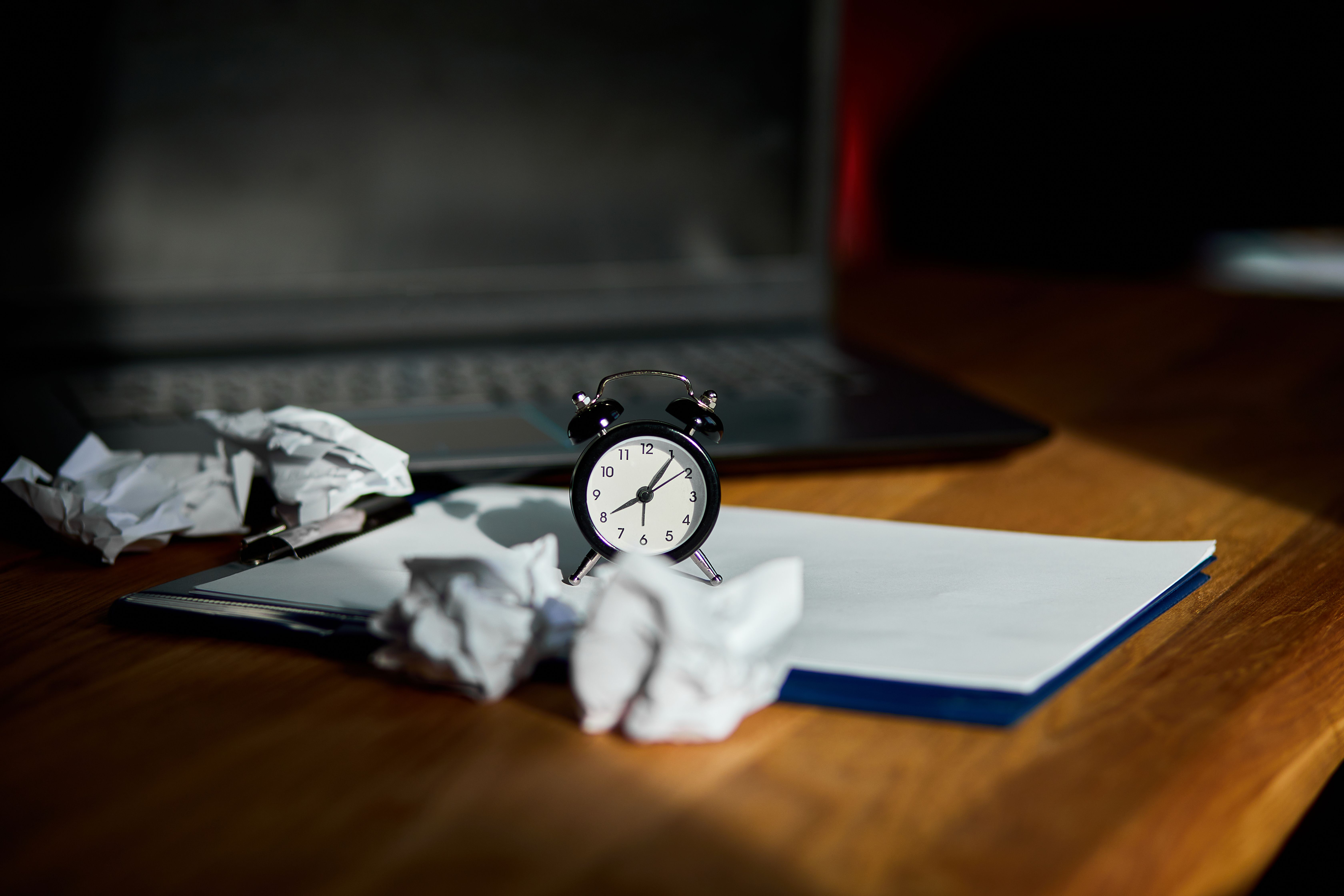 Modern workplace with clock and pages