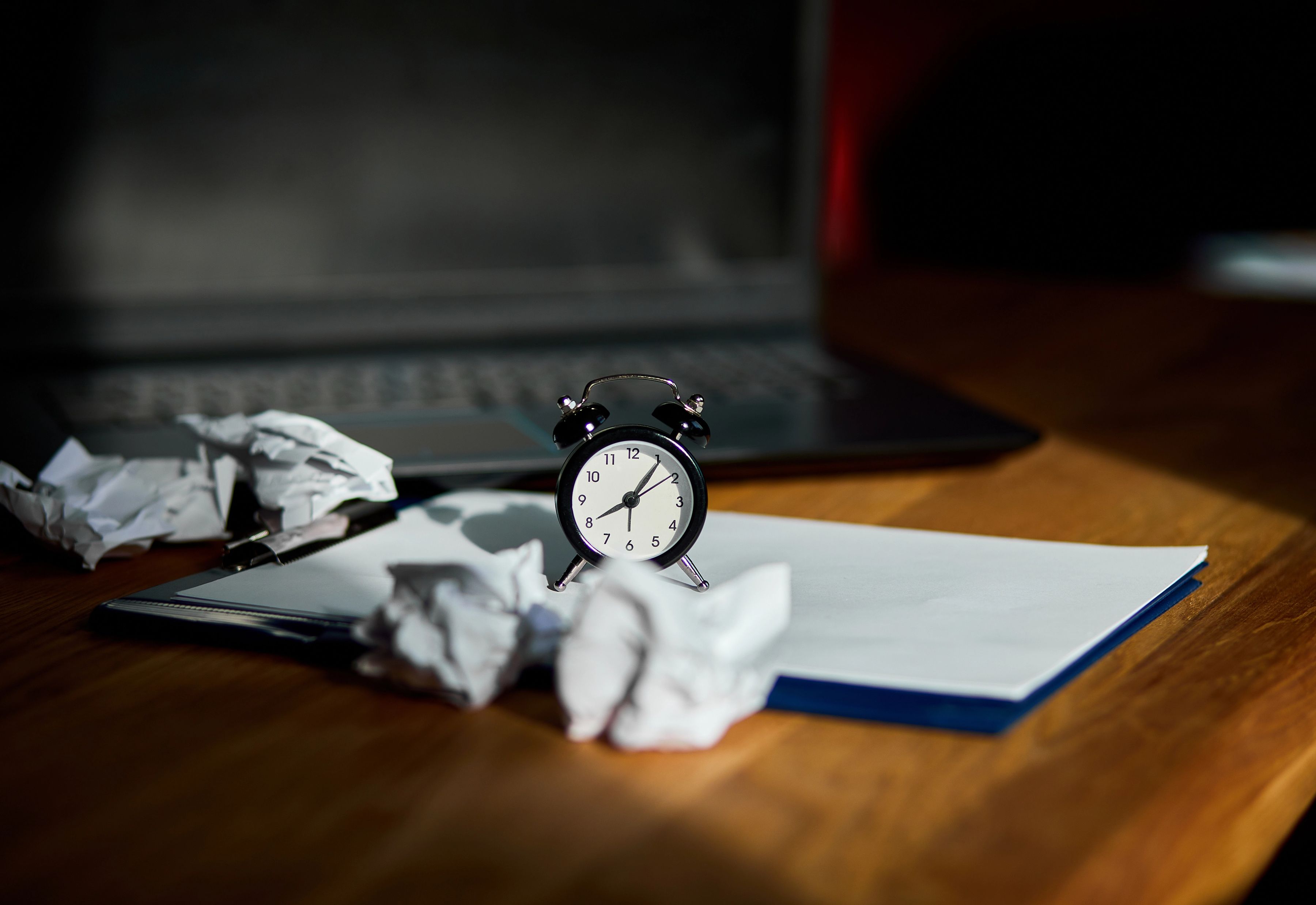 Modern workplace with clock and pages