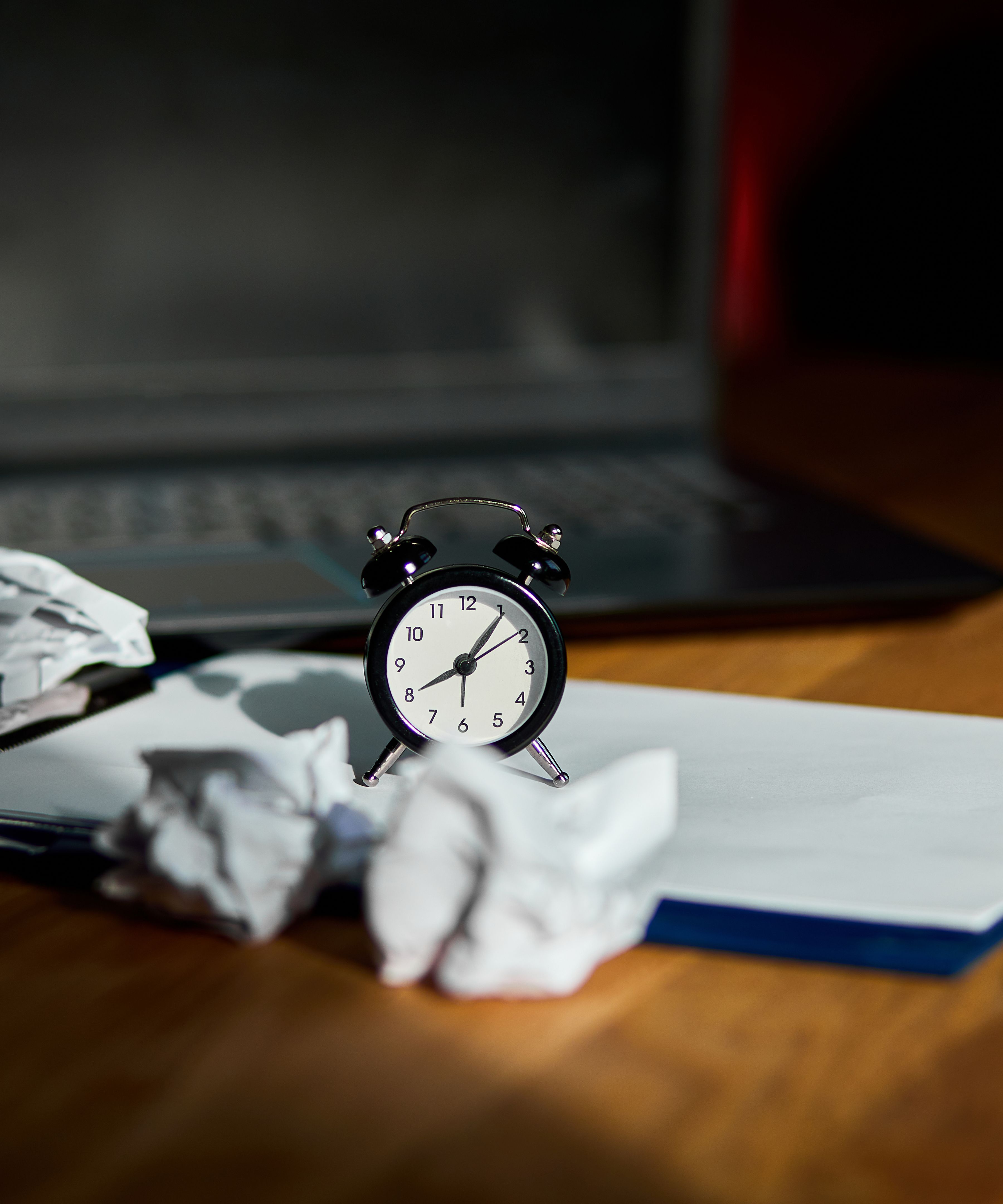 Modern workplace with clock and pages