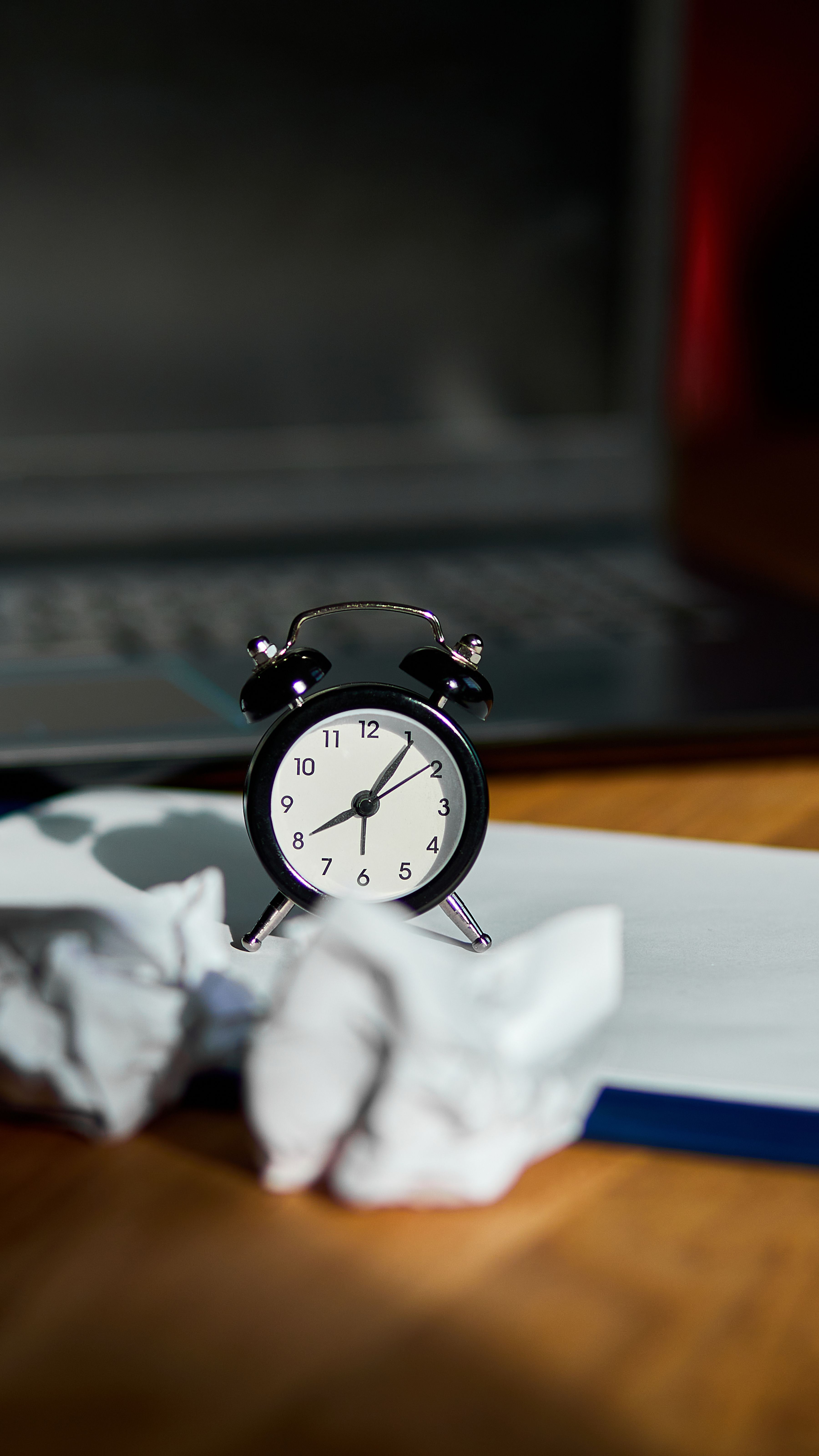 Modern workplace with clock and pages