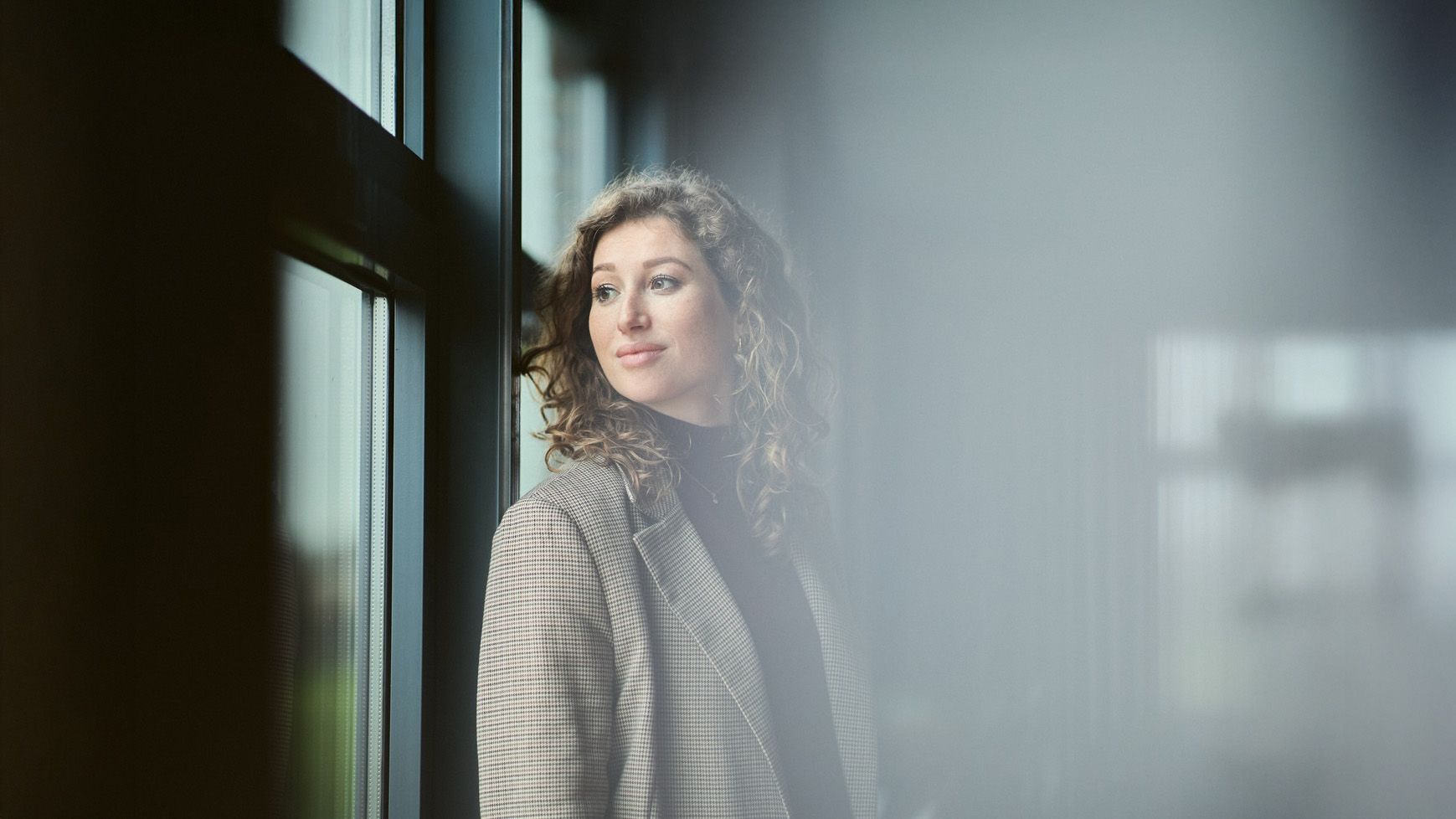 woman looking out of the window