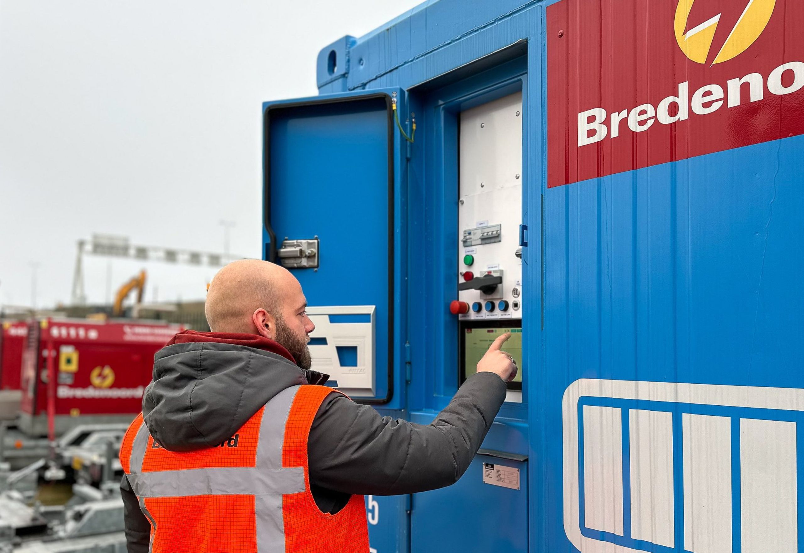 Man with a Bredenoord container