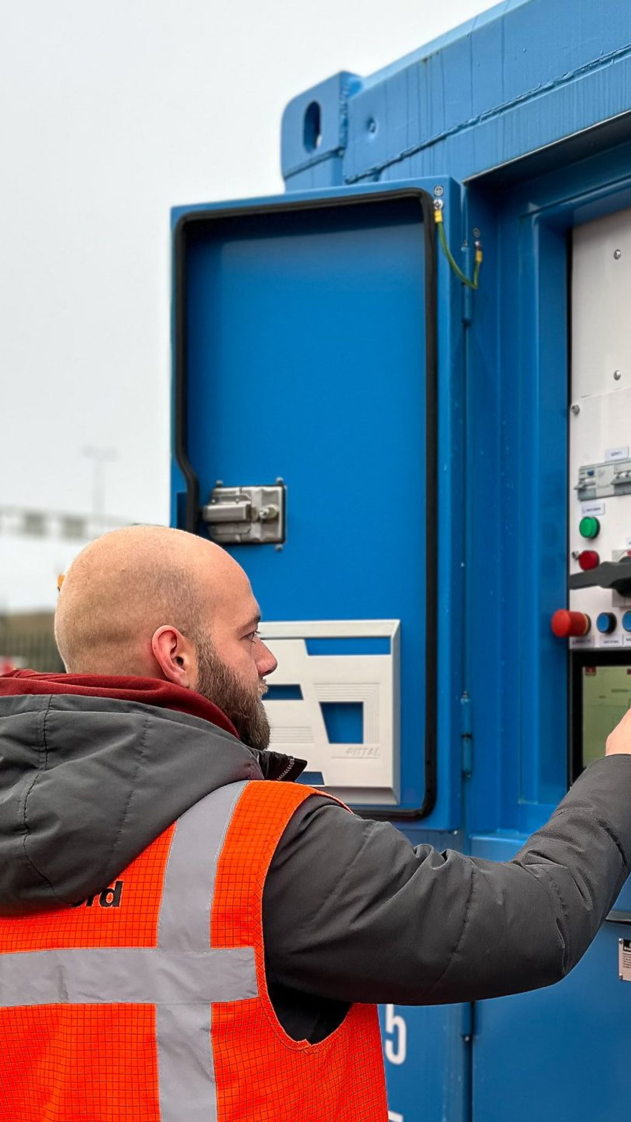 Man with a Bredenoord container
