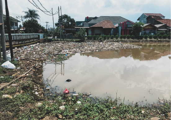 A body of water with trash in it.